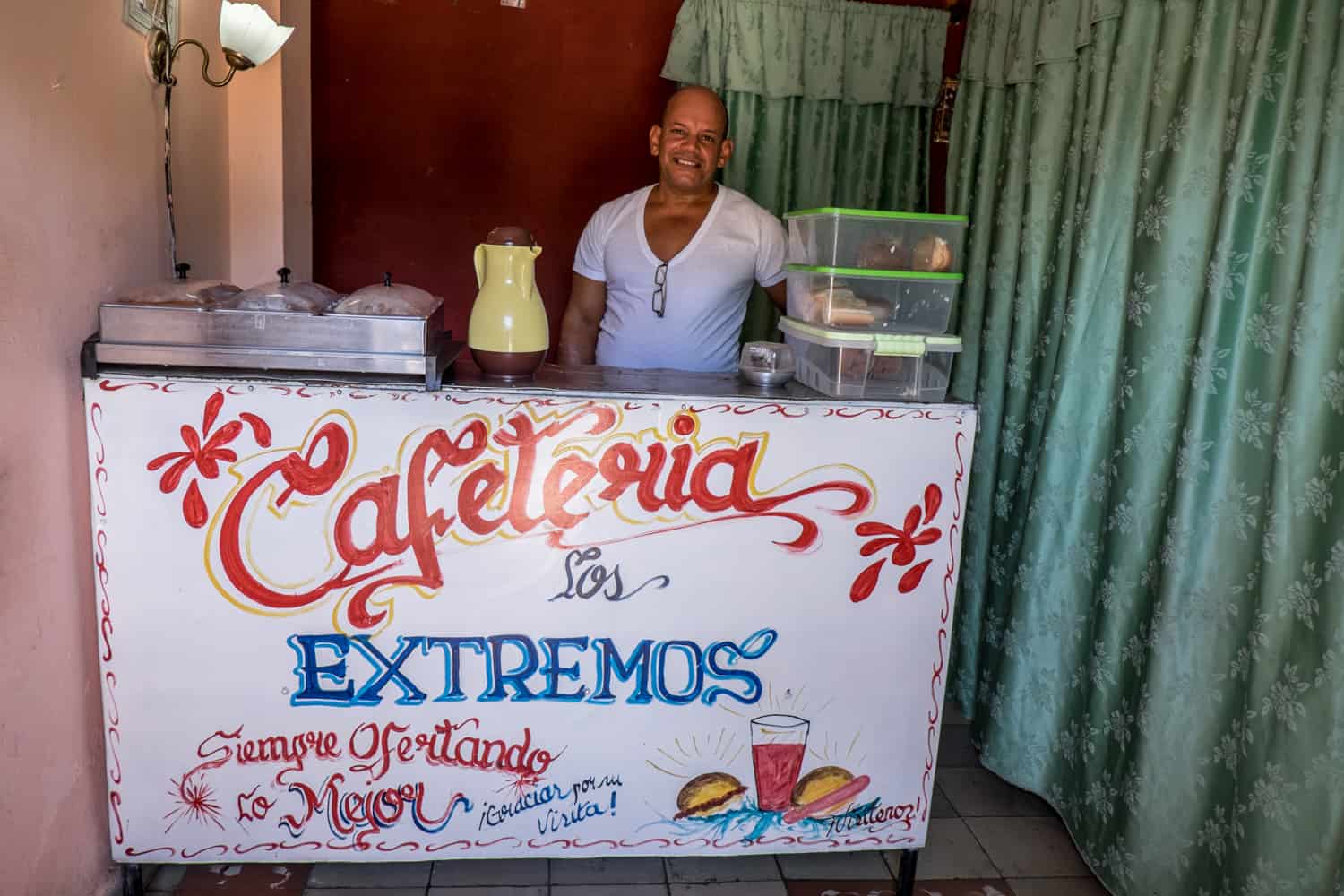 A Cuban man and his Cafeteria set-up in a house. A typical Cuban enterprise. 