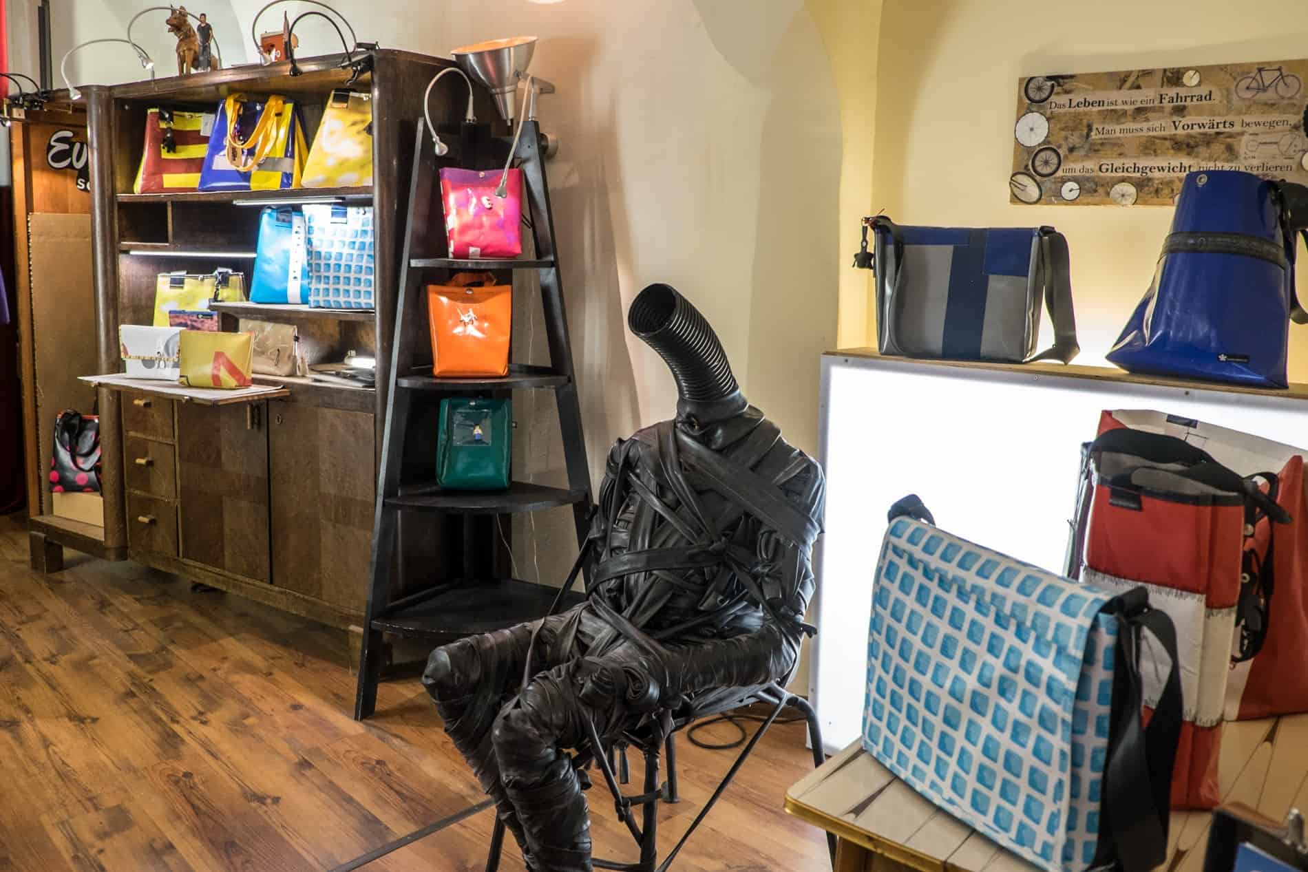 Interior of a design charity shop in Graz, Austria with upcycled wares and sculptures.