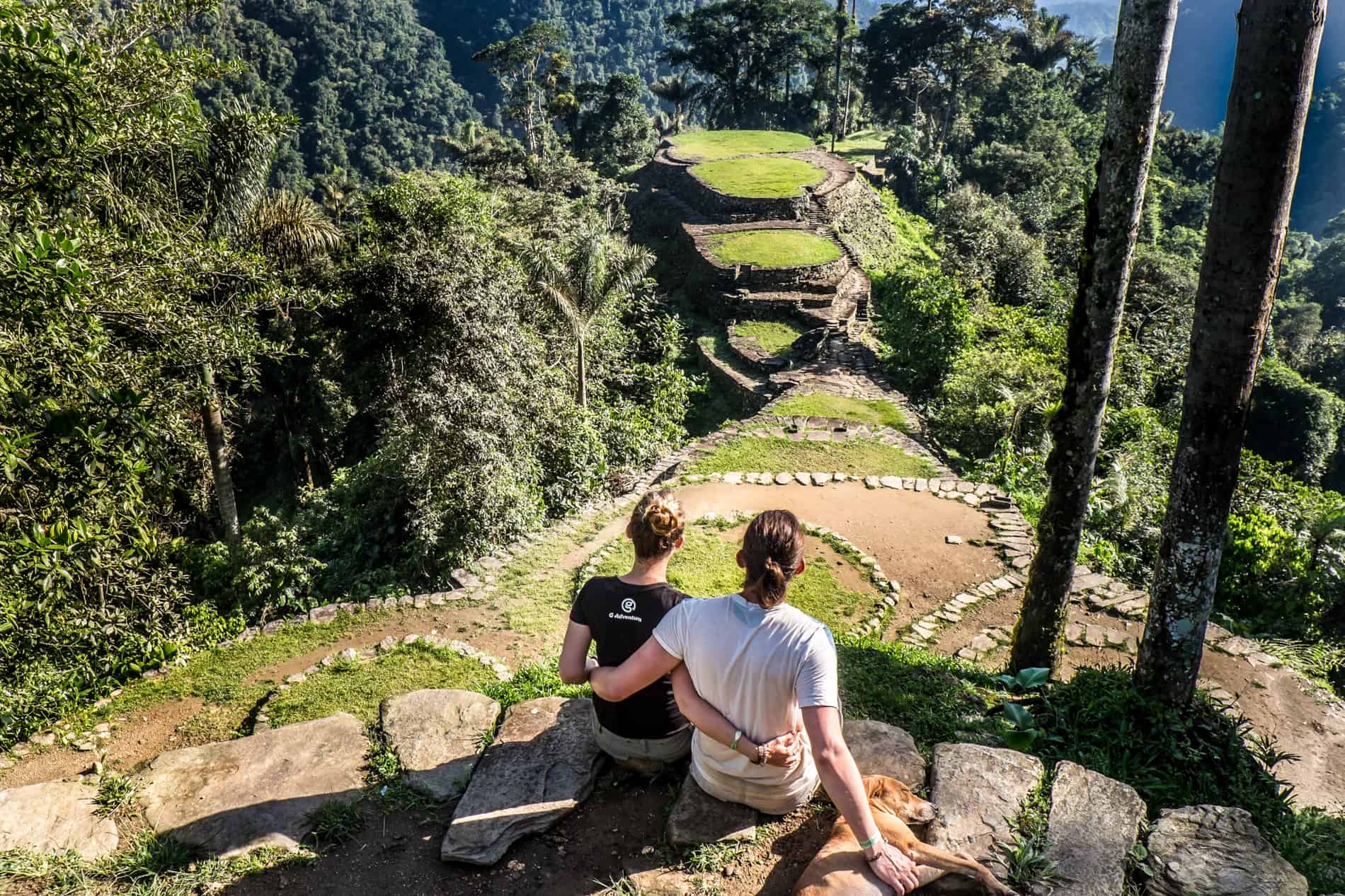 A couple looking at the view of the mountain top, terraced Lost City in Colombia.