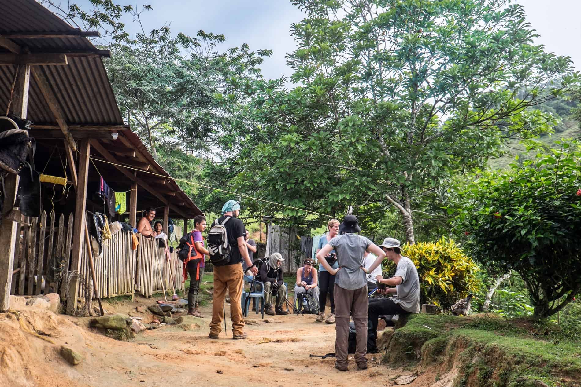 Hikers resting at a local house along the Lost City Trek route. 