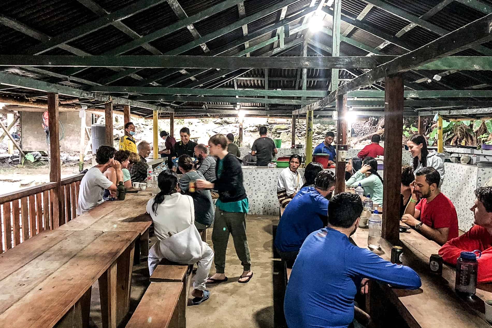 A group of trekkers at a Lost City trek campsite dining room.