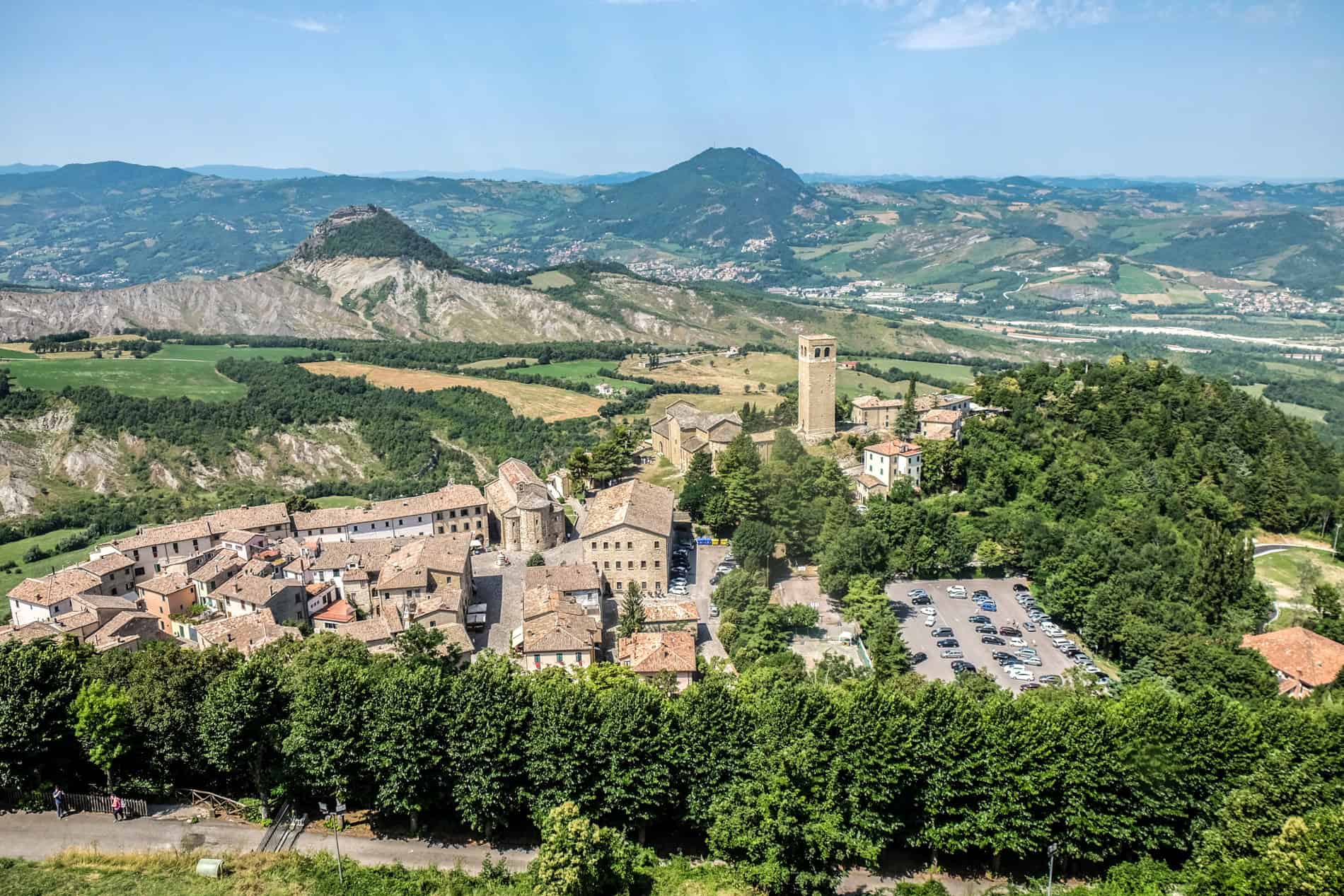 The hilltop medieval town of San Leo surrounded by forest. 