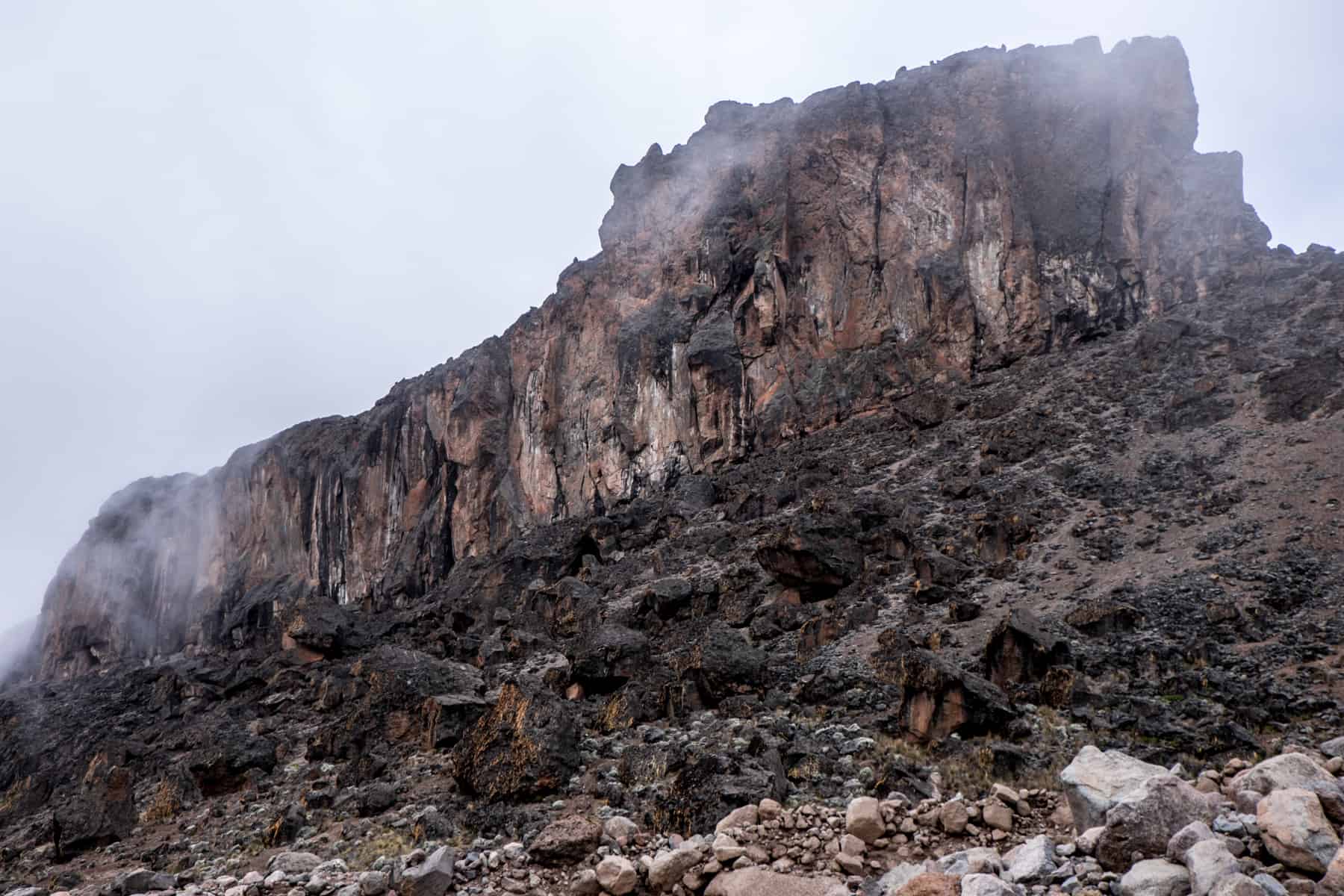 The burnt orange and black rectangular rock known as the Lava Tower, seen on the Kilimanjaro climb.