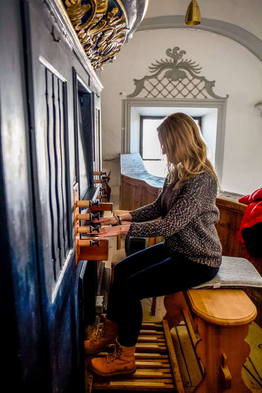 A woman plays Franz Xaver Gruber's Organ in the Arnsdorf Church in Austria 