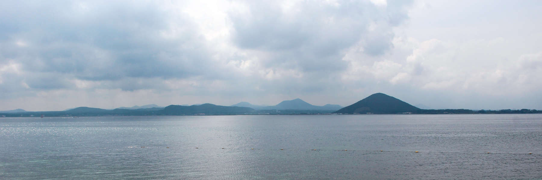 A panorama of volcanic mounds and peaks on Korea's Jeju Island - a unique typography where Korea's largest mountain can be found