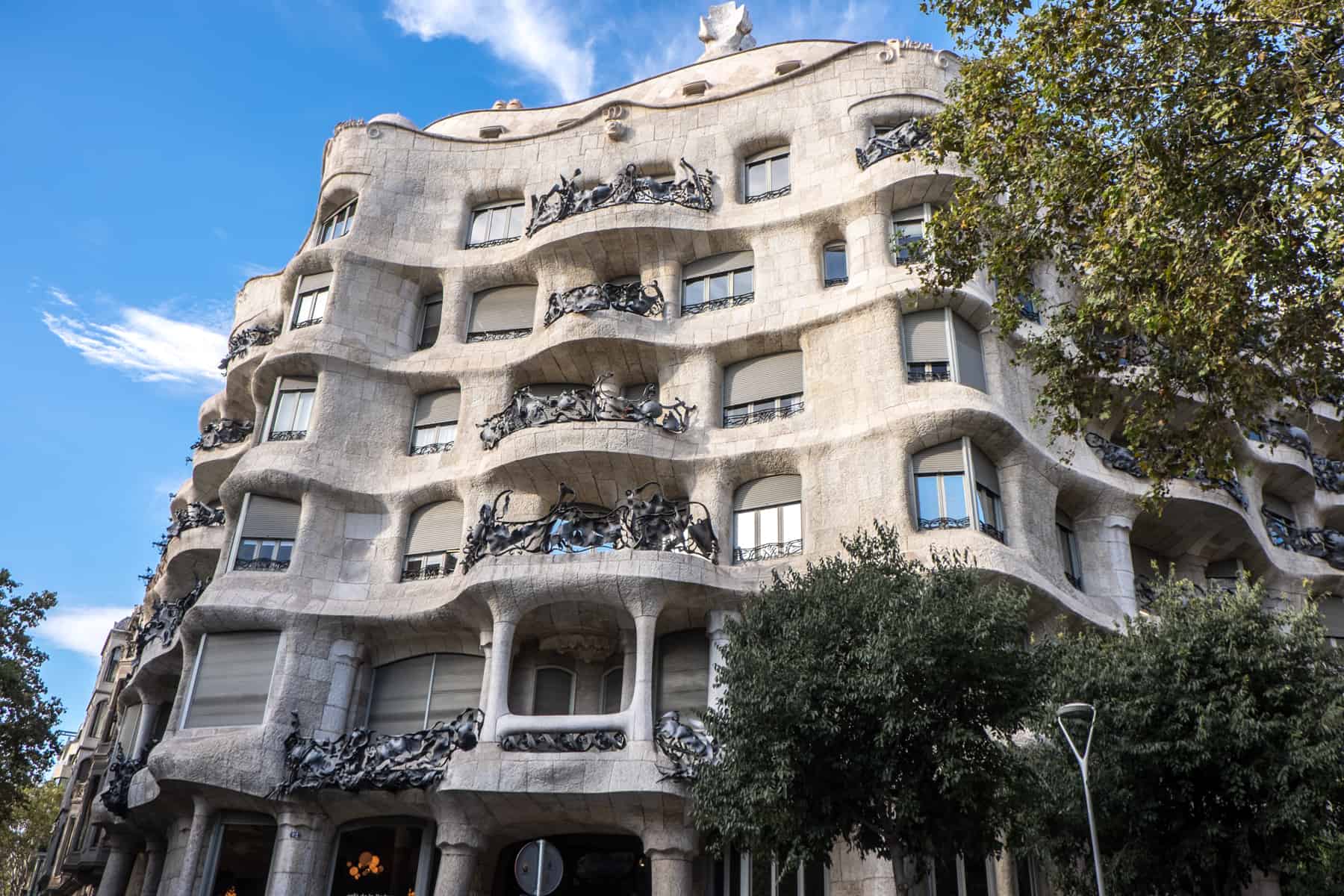 The egg-white coloured , curved floors and balconies of Gaudi's famed Casa Mila in Barcelona, as seen from the street. 