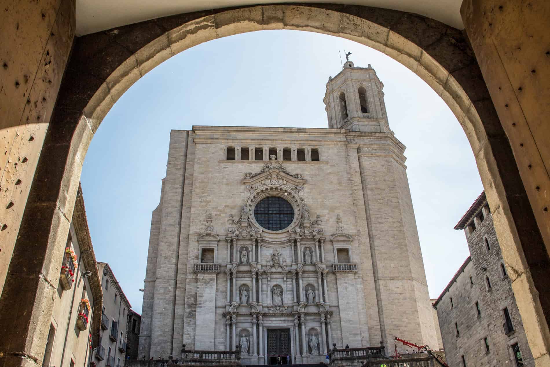 From from a medieval archway to the sculpture adorned facade of the Força Vella Cathedral in Girona.