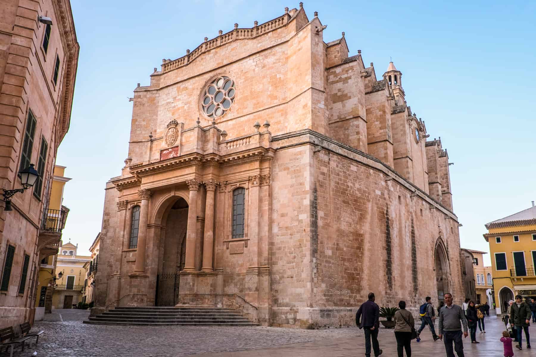 The large golden orange structure of the Ciutadella Cathedral on the island on Menorca.