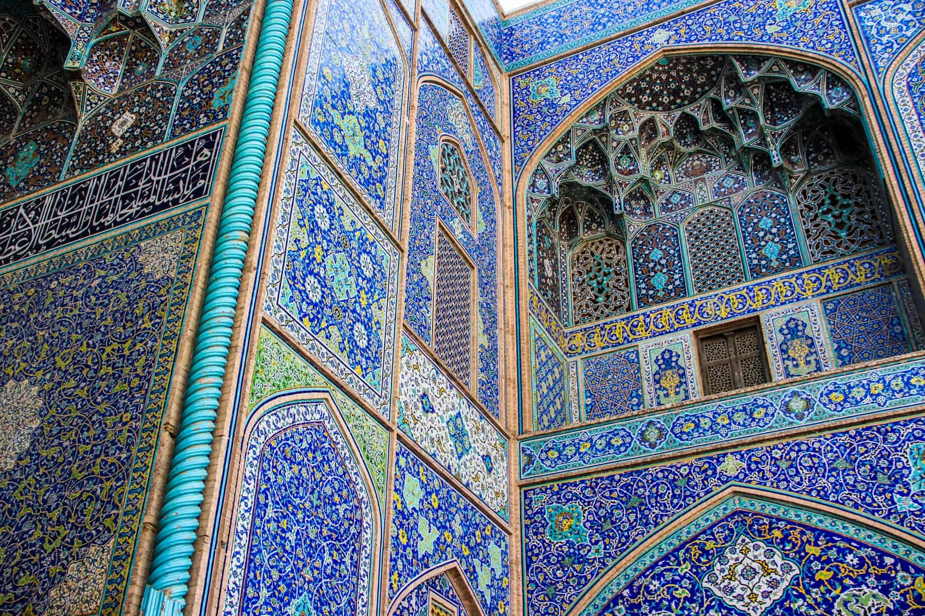 Close up of the gold and blue mosaic interior of the Sheikh Lotfollah Mosque in Isfahan.