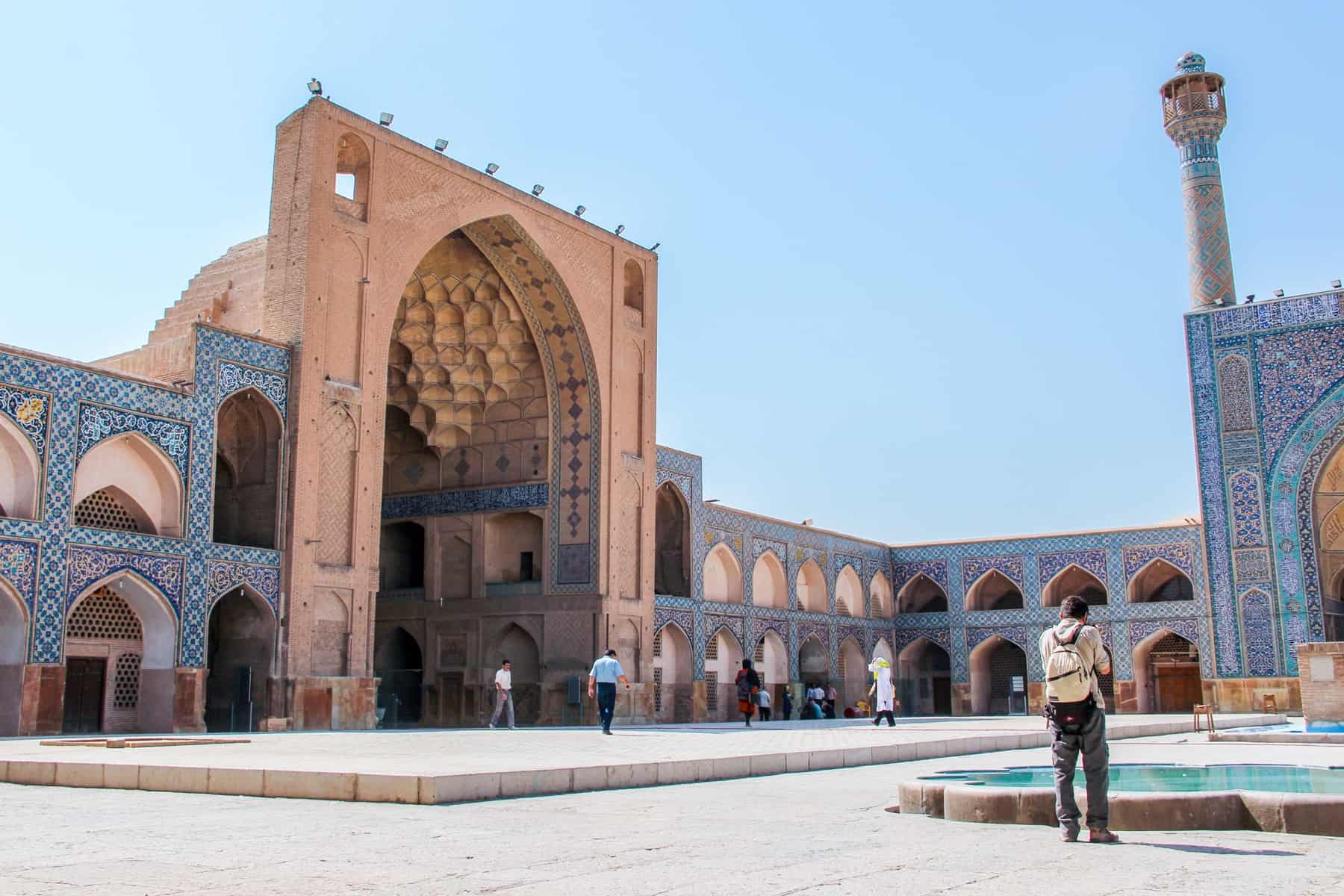 Iran tourism at golden stone and blue mosaic Great Mosque (Masjid-e Jameh) of Isfahan, a UNESCO World Heritage Site. 