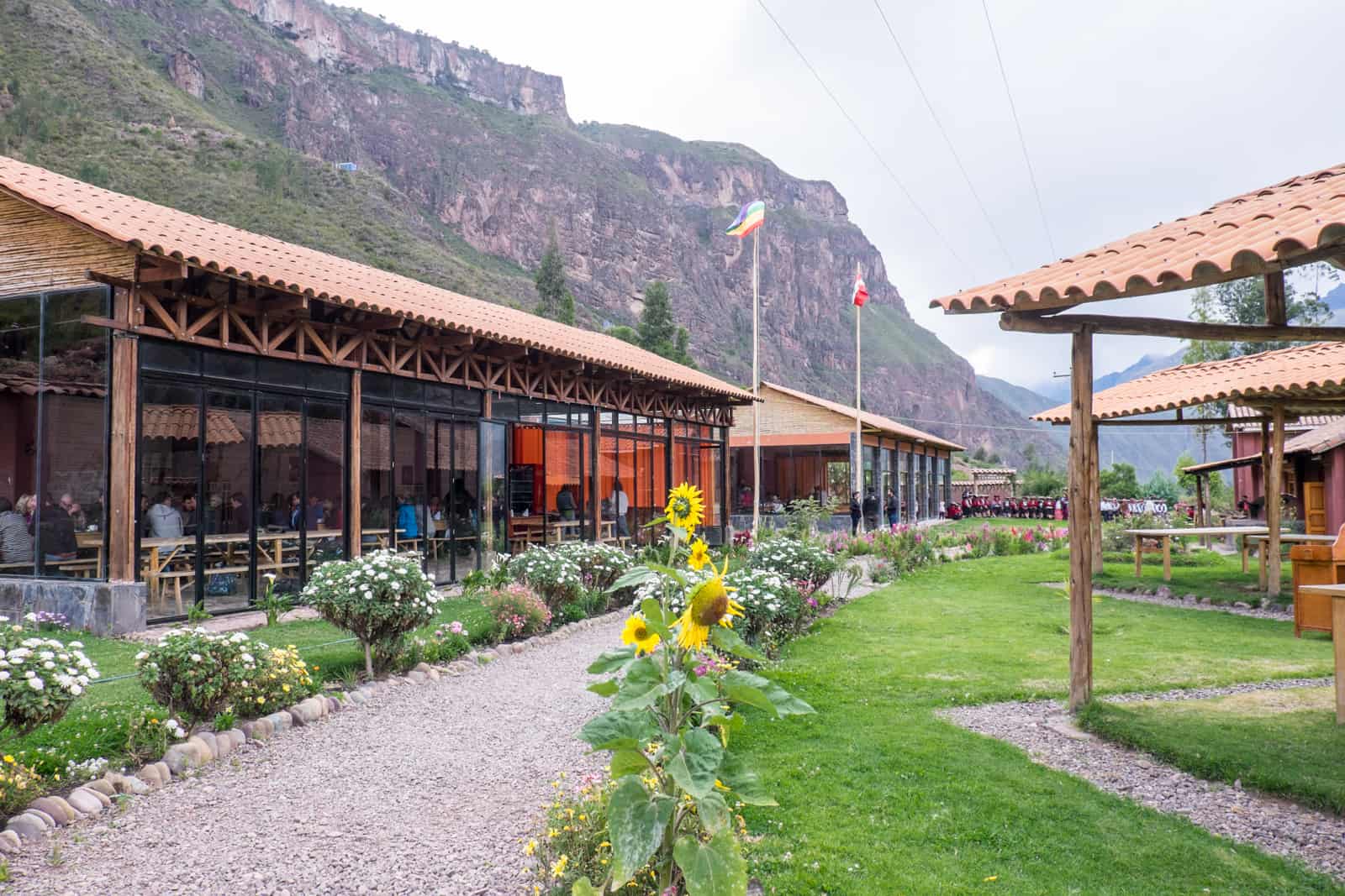 Trekkers on the Inca Trail dine at long tables at the Parwa Community Restaurant in the Sacred Valley.