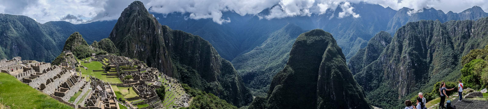 The stone Inca ruins of Machu Picchu set within the pinnacle mountains of the Sacred Valley in Peru.