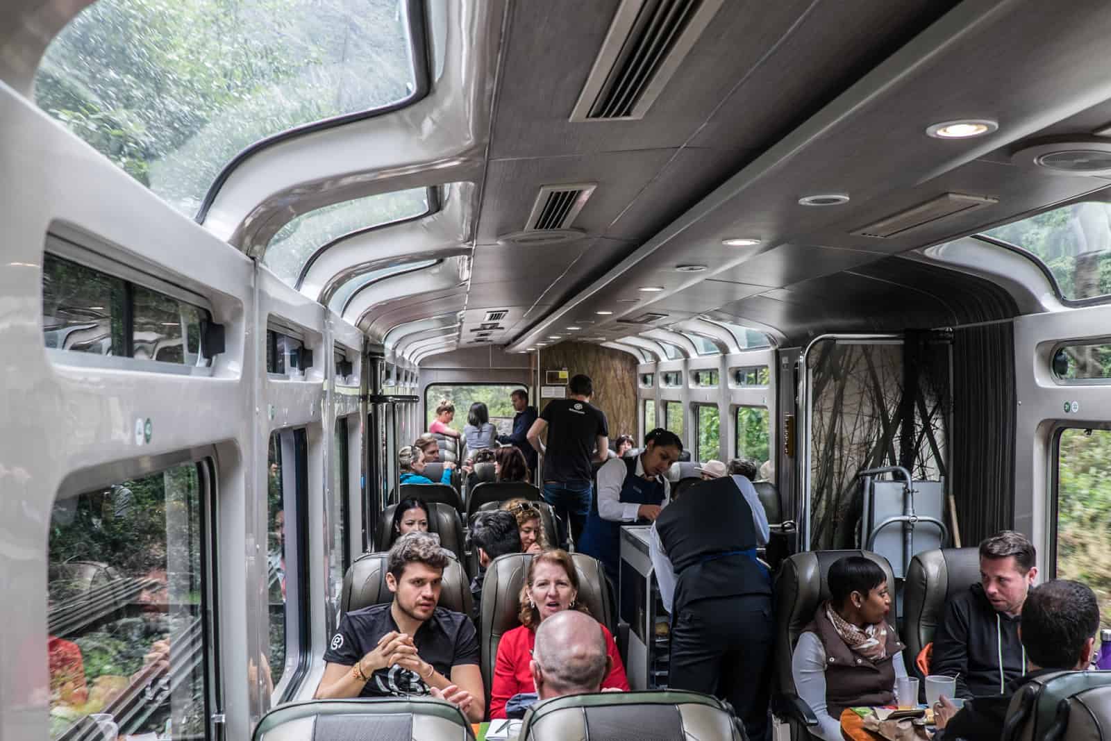 Passengers inside a Machu Picchu train carriage in Peru.