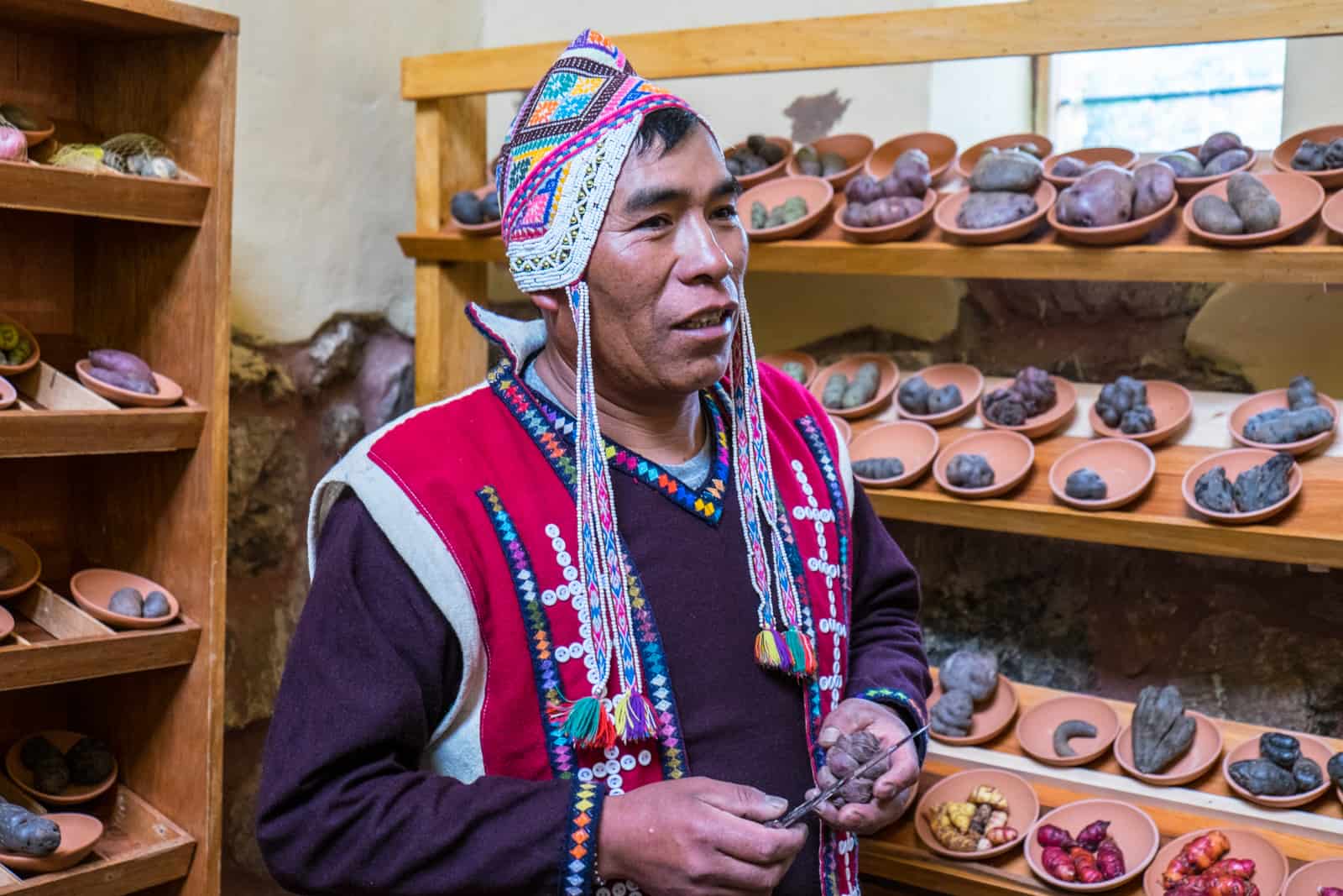 An indigenous man explains the 3,000 varieties of potato in Peru at the Parque de la Papa conservation project