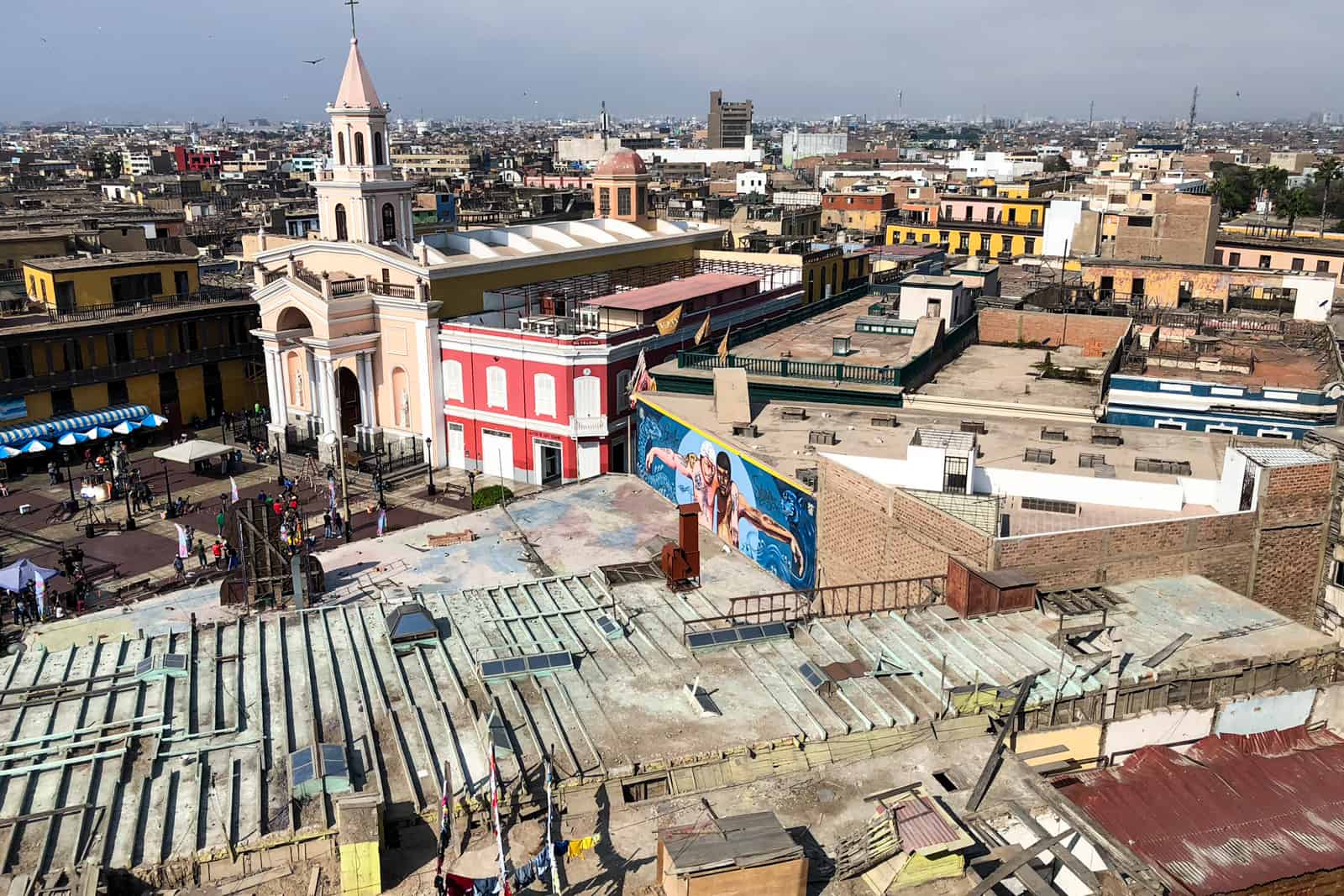 Elevated view of the Callao neighbourhood in Lima, Peru with street art and colourful buildings. 