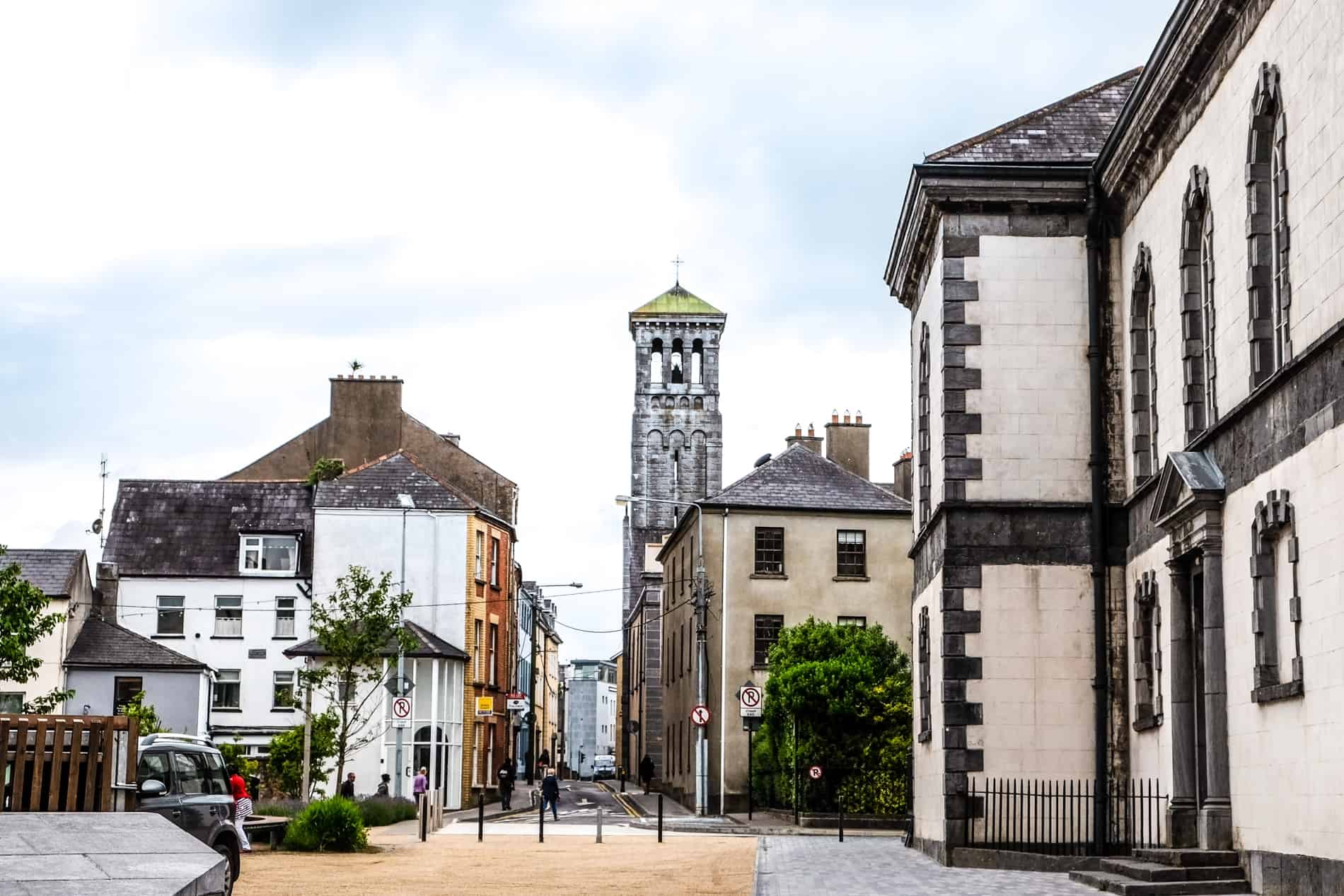 Historical streets, houses and stone towers in Waterford city, Ireland. 