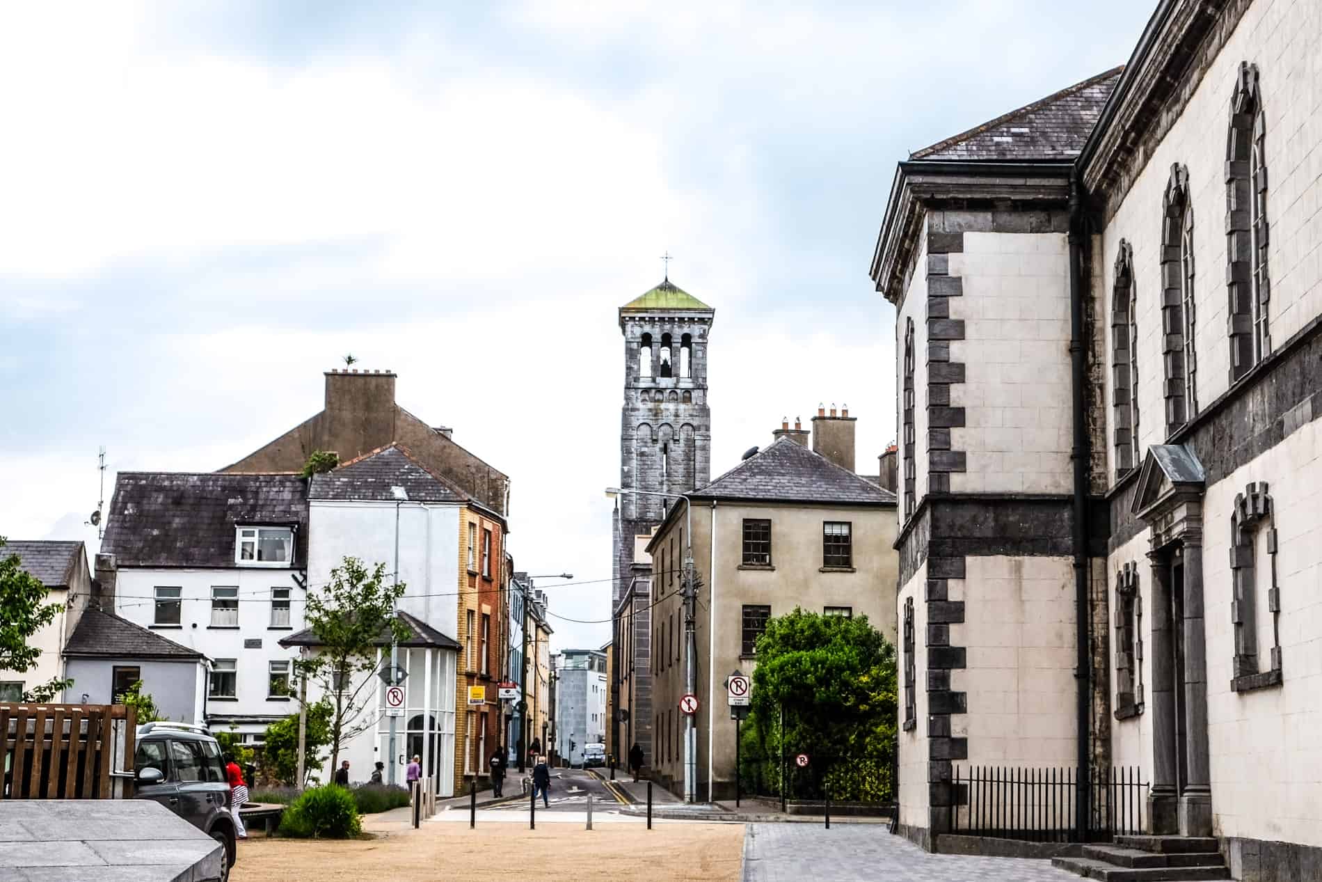 Historical streets, houses and stone towers in Waterford city, Ireland.