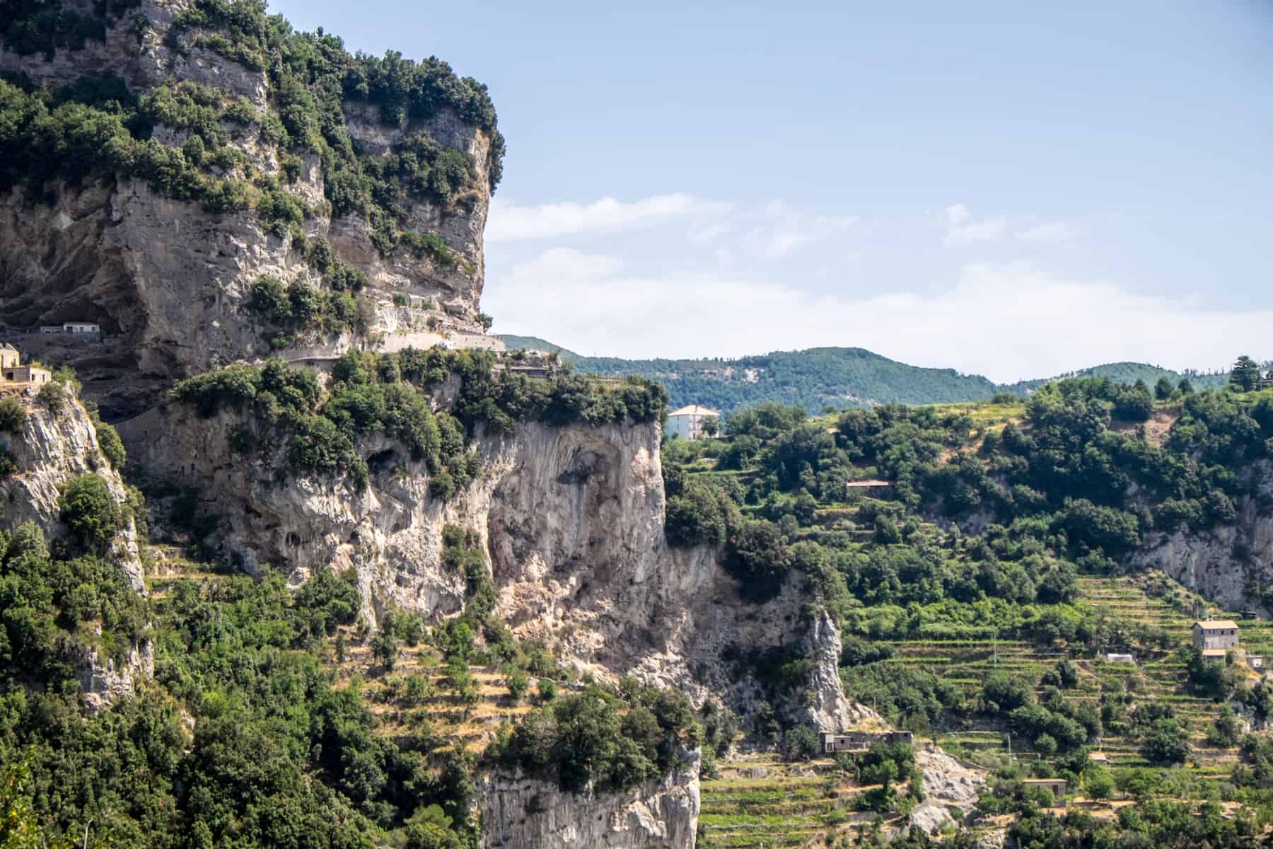 Greern terraced hills and stacked cliff rocks high above the Amalfi Coast on the path of the Gods hike. 