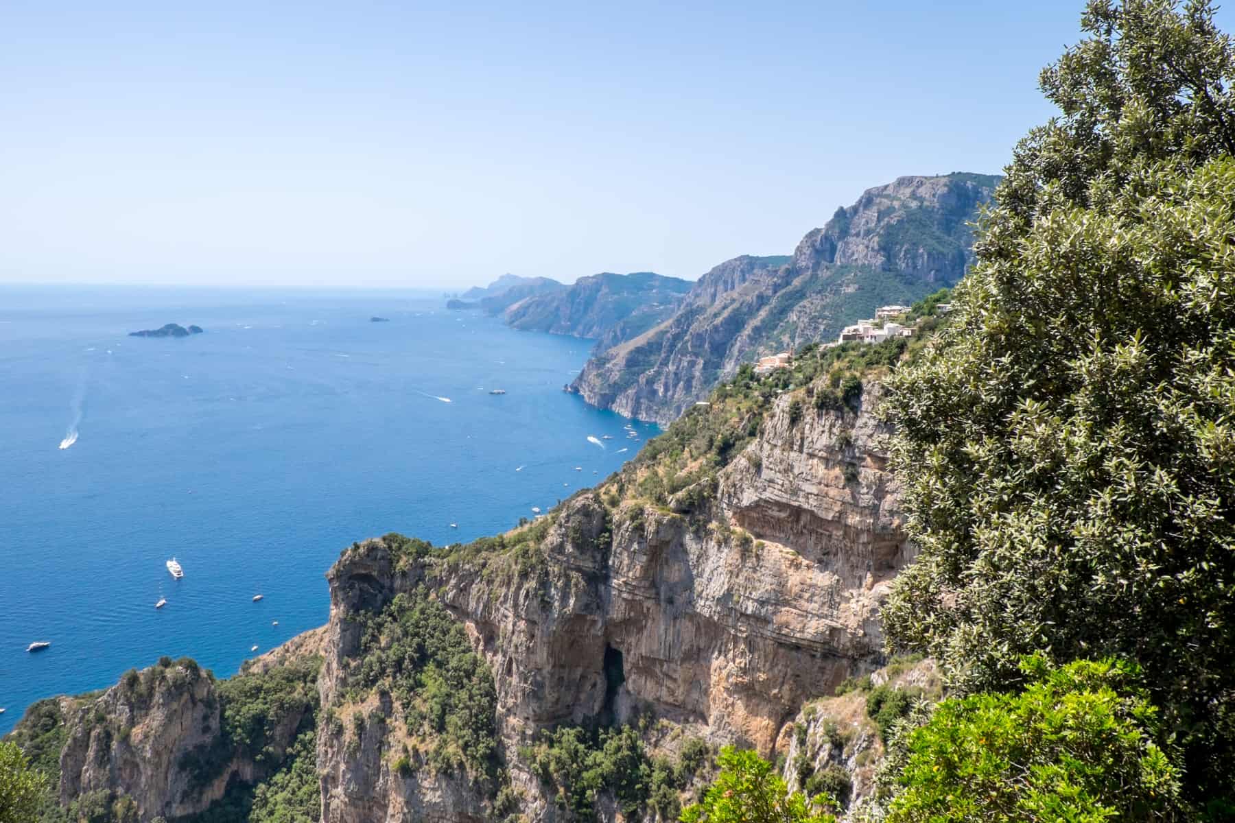 Elevated view from the Path of the Gods overlooking the jagged mountains of the Amalfi Coastline. 