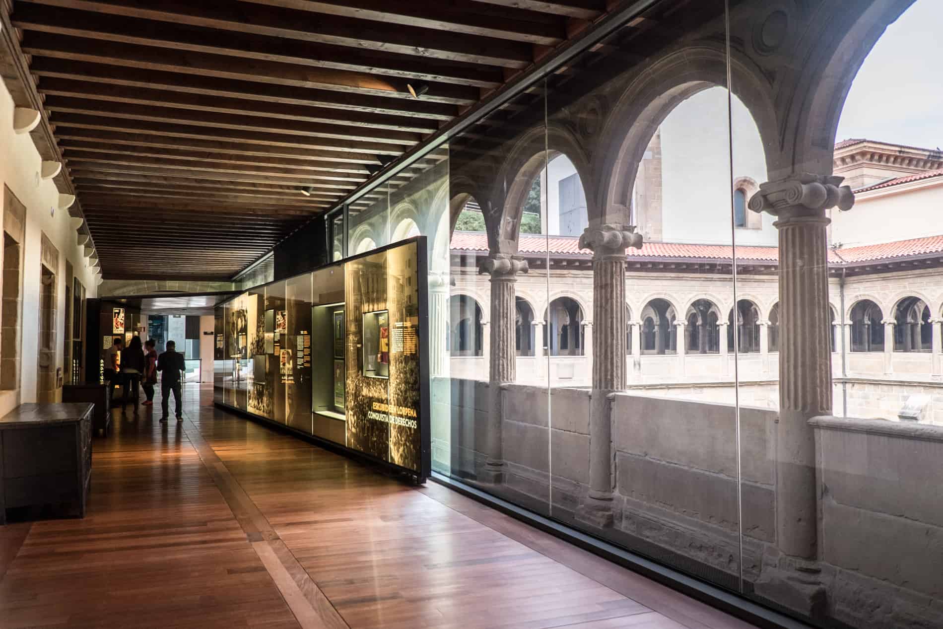 Exhibits line a hall in an old convent in San Sebastian, now the San Telmo Museum of Basque history.