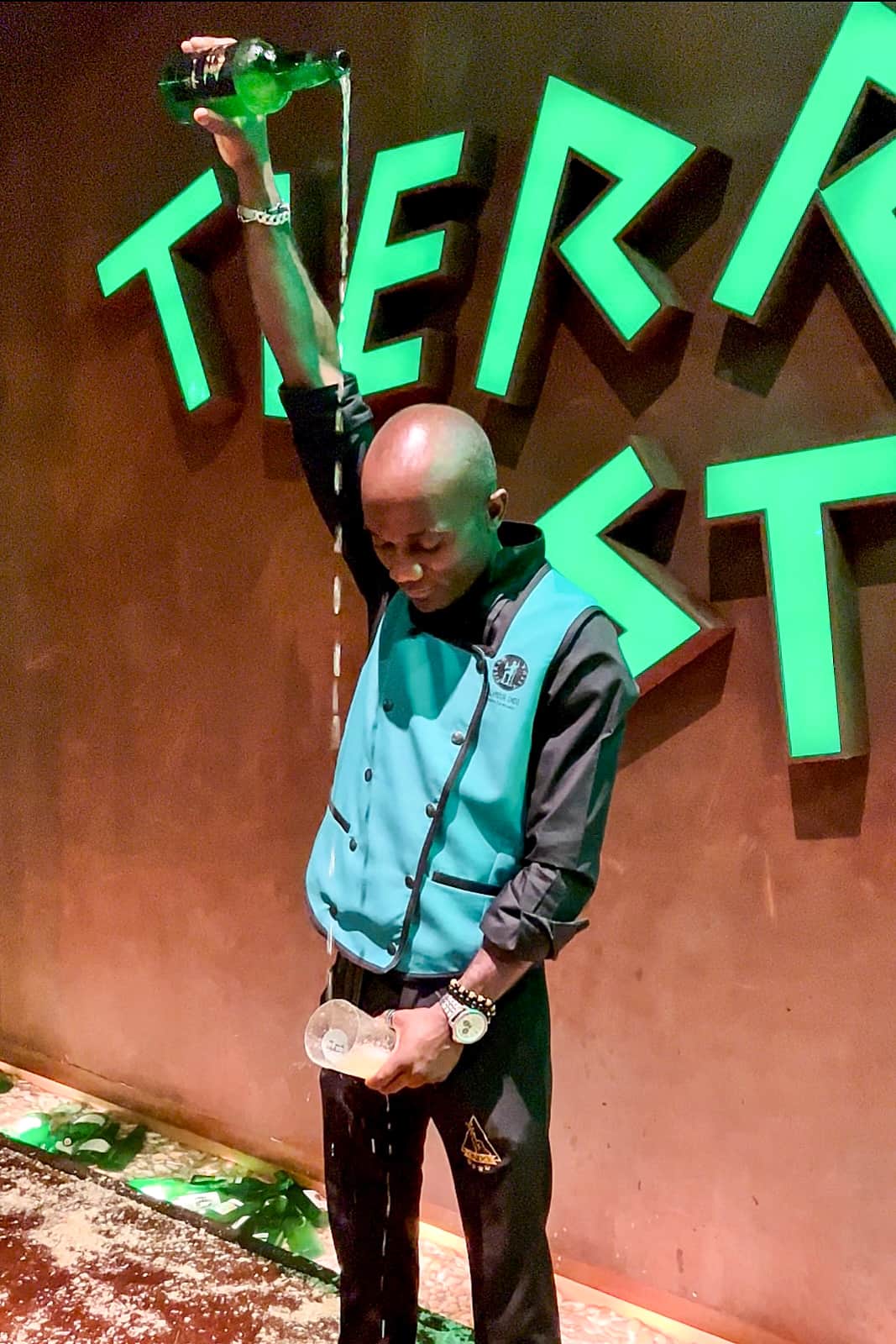 An Escanciador (cider pourer) demonstrating the perfect Culete (small pour) of cider in Asturias - a great show and a long-standing tradition. 