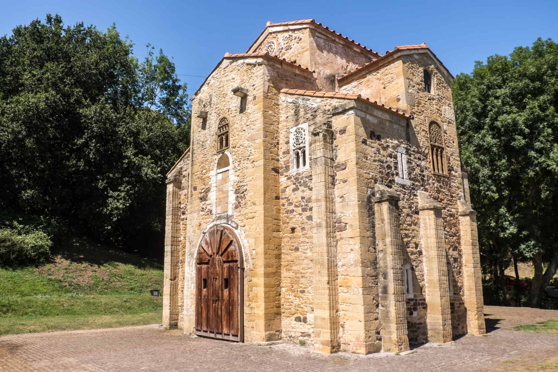 The small, stand alone structure of San Miguel de Lillo – a Pre-Romanesque church in Oviedo, built in 842. 