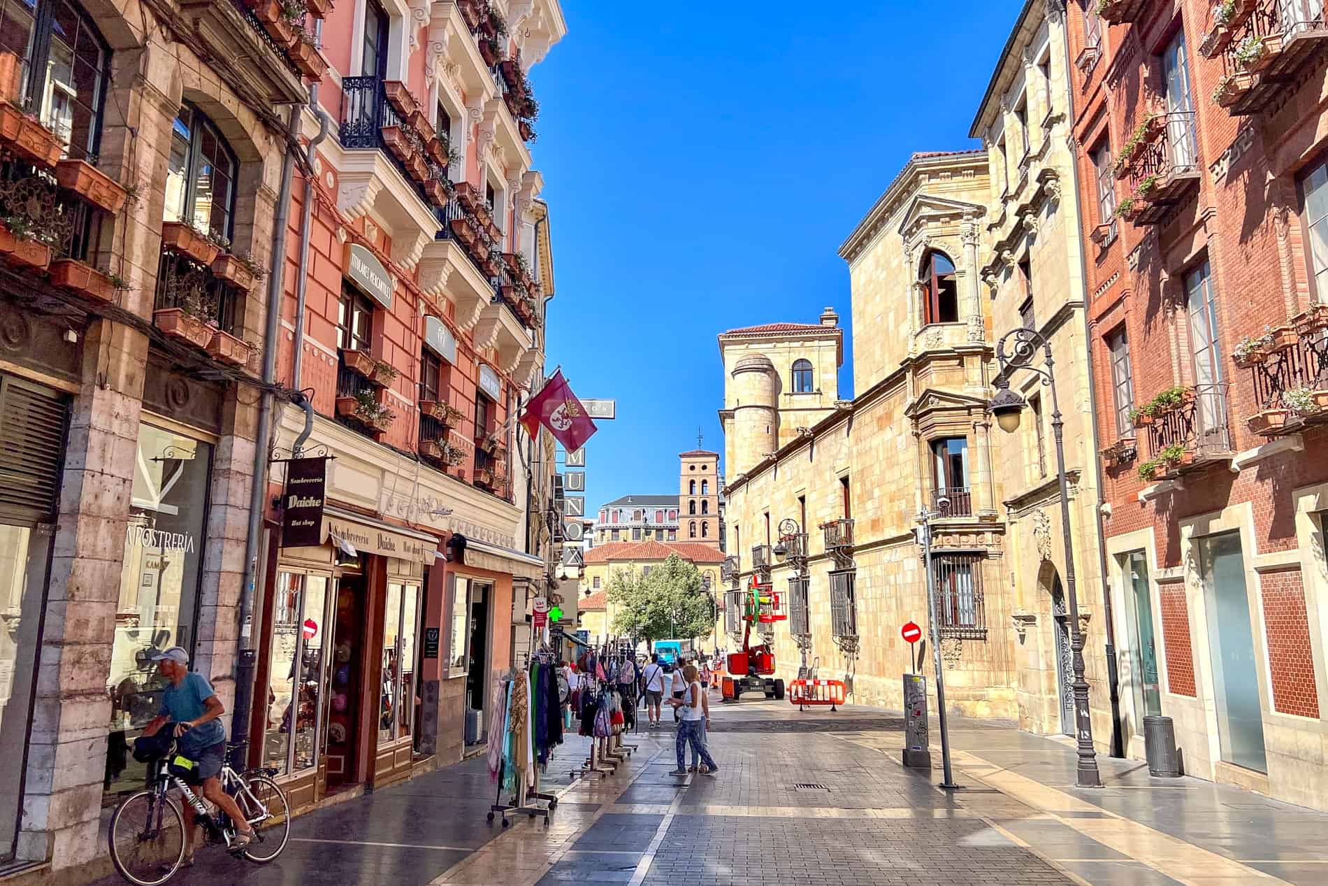 Yellow and ochre red buildings on a main street in León city Spain.