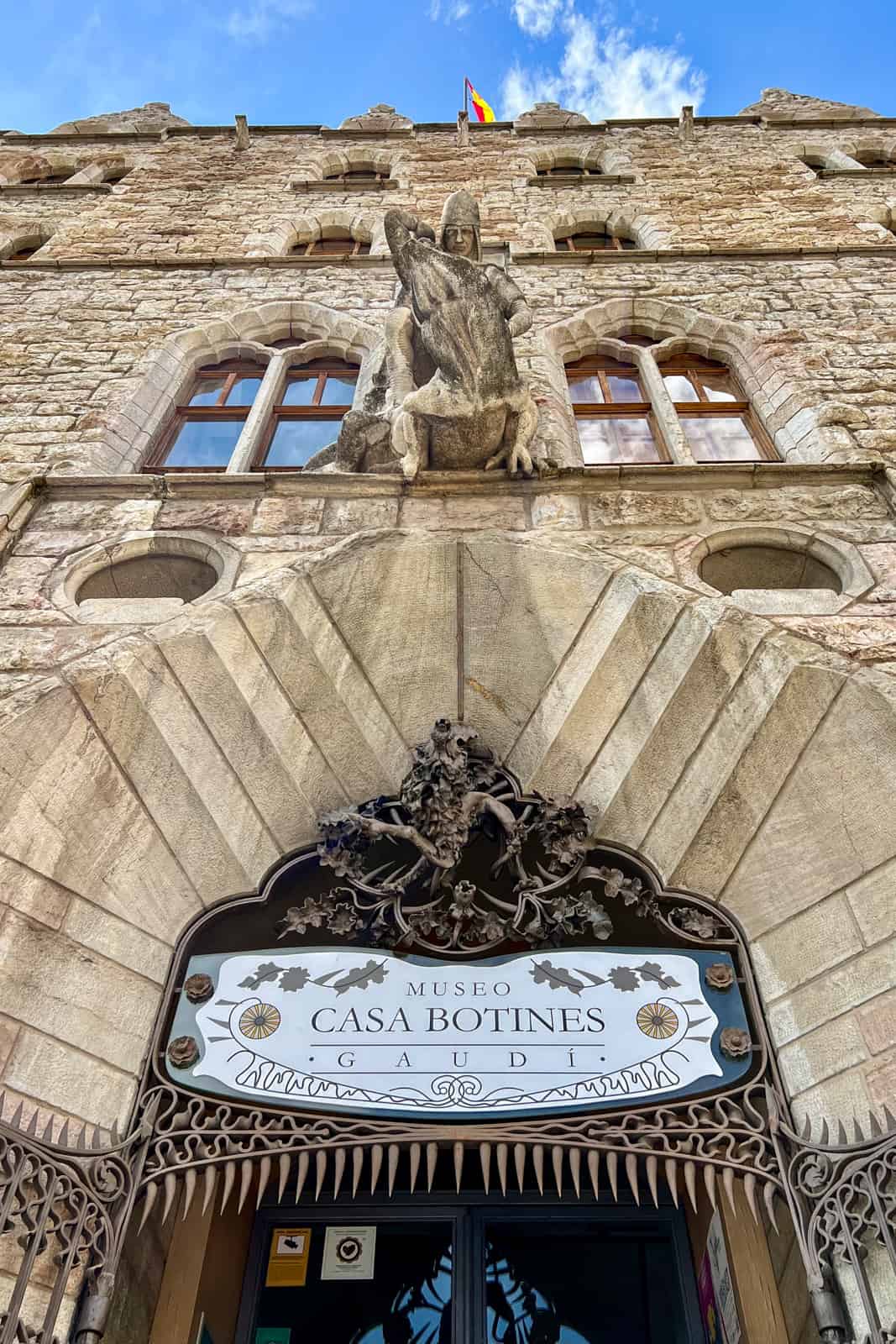 Limestone sculpture of Saint George slaying a dragon above the entrance to Case Botines in León, Spain. 
