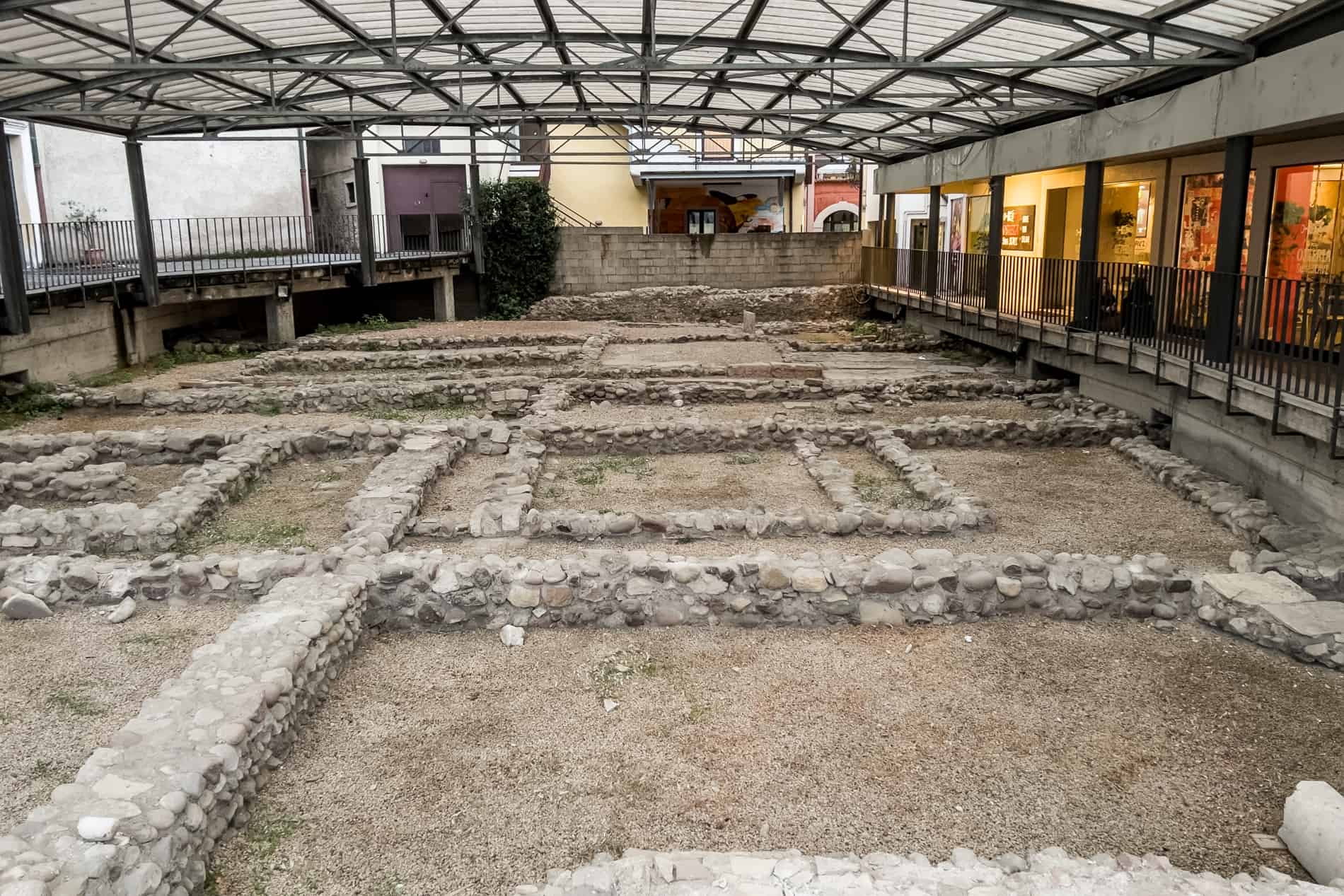 Stone squares roman ruins in Peschiera del Garda, covered by a roof. 