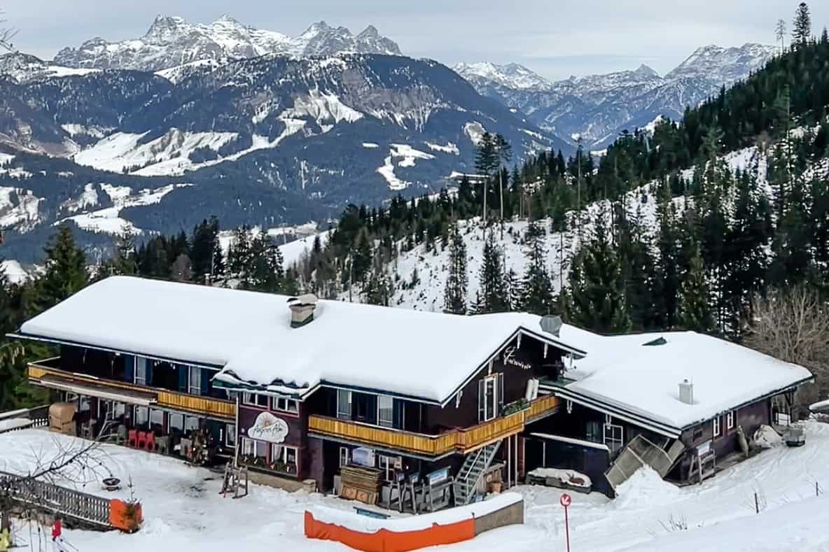 Elevated view of the Angerer Alm mountain hut set on the ski slopes of St. Johann in Tirol. 