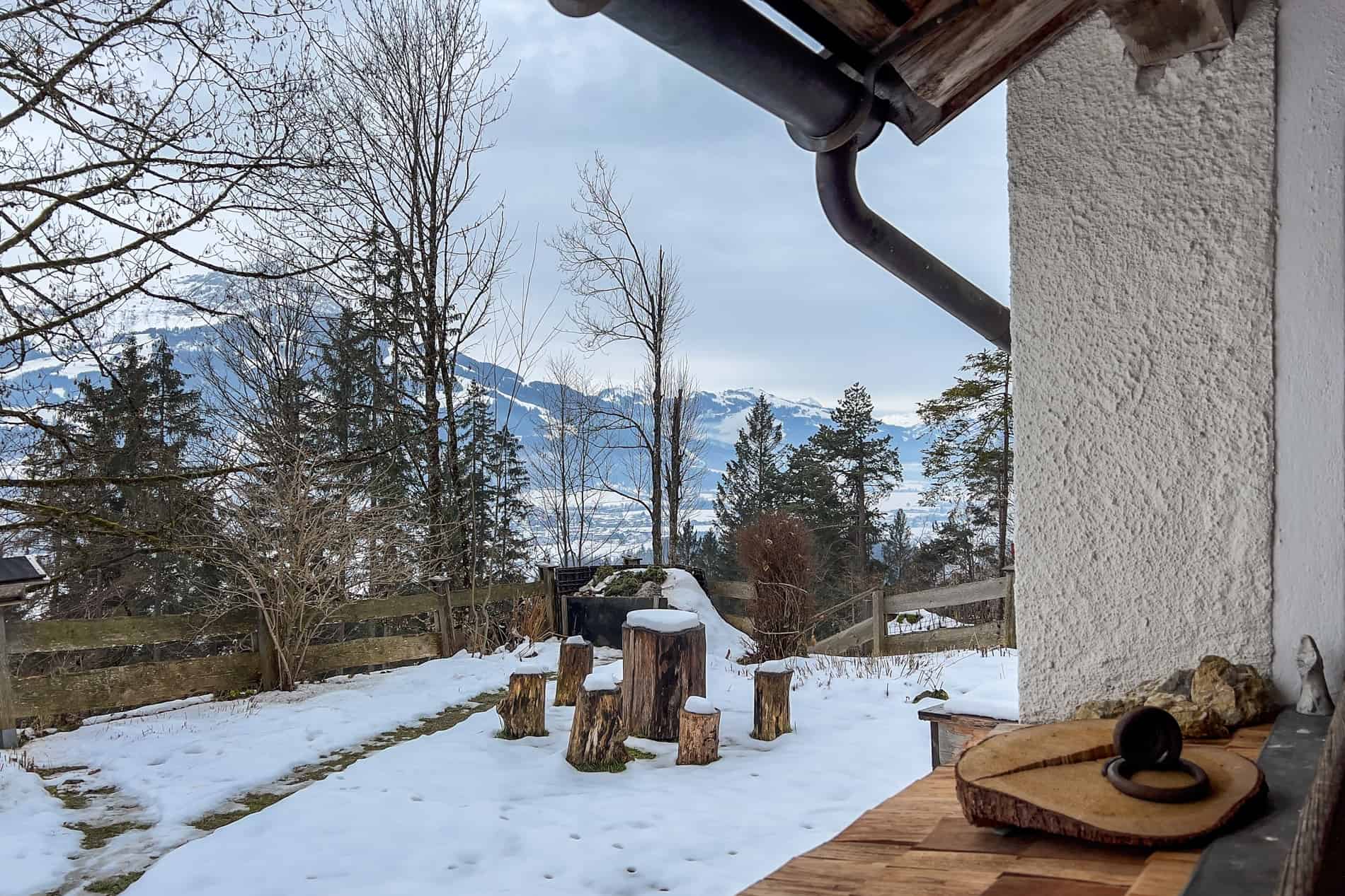 A view from inside a forest-set chapel, looking towards the Kitzbüheler Horn mountain in Austria. 