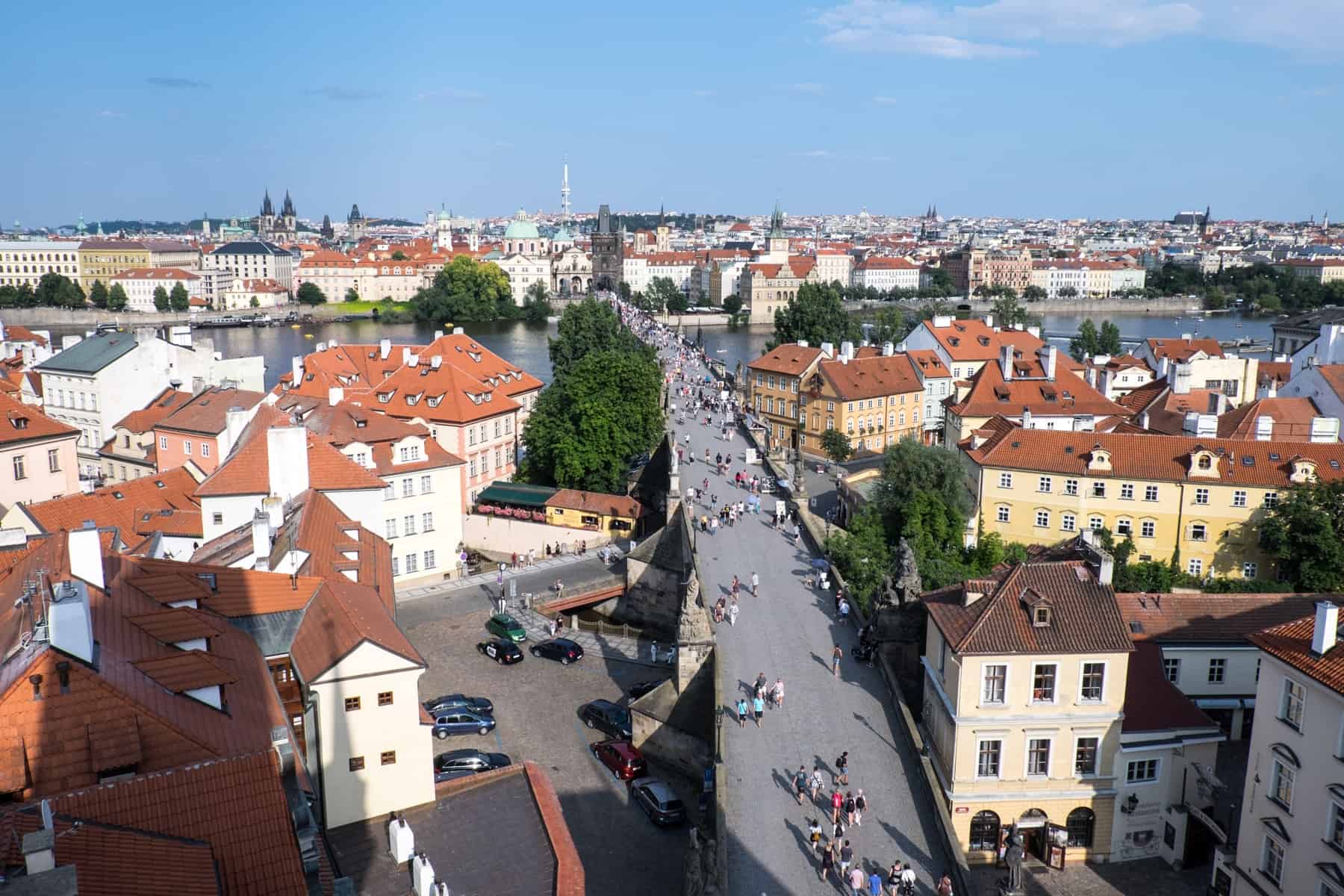 Elevated view overlooking Charles Bridge connecting the two sides of Prague either side of the Vltava River. 