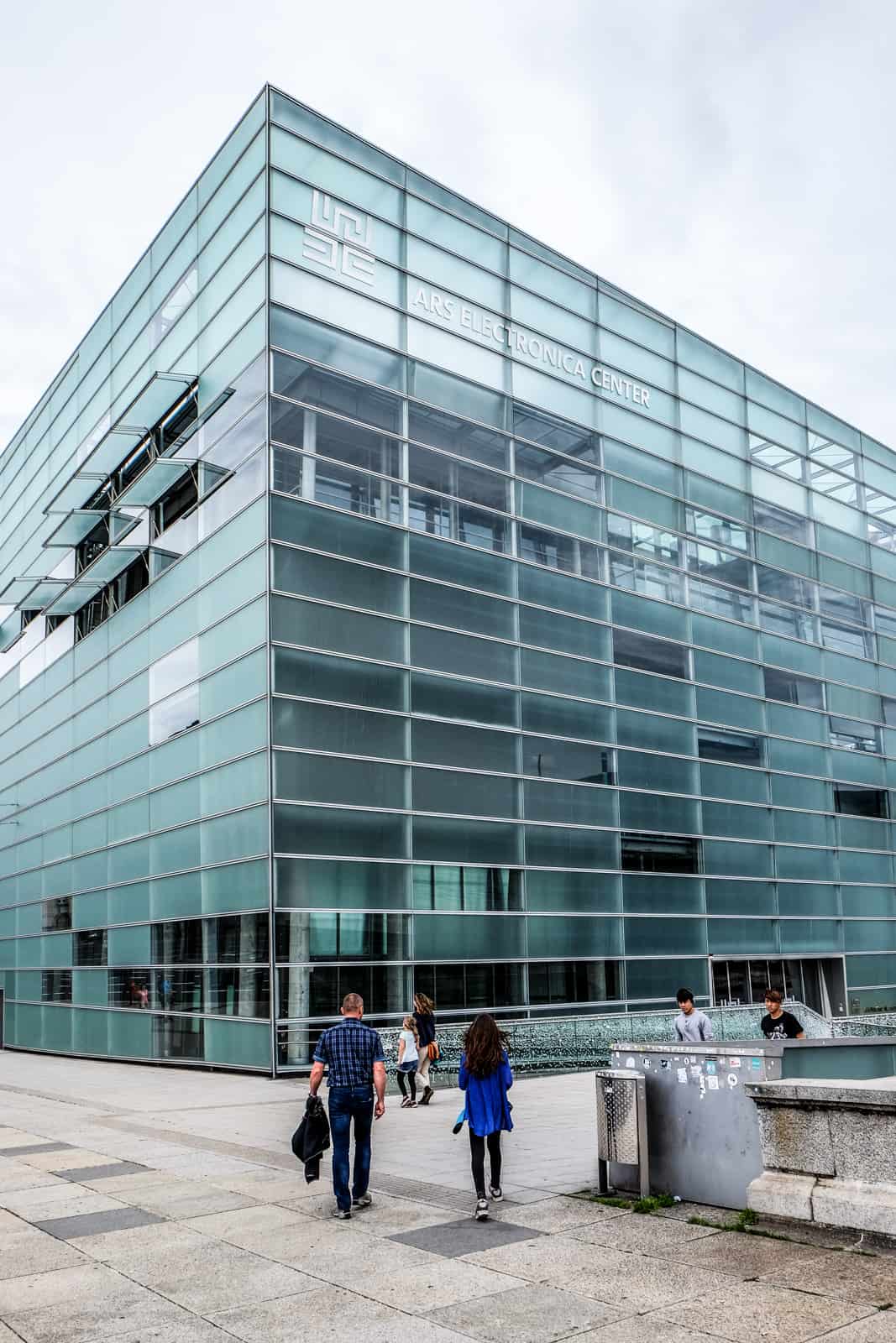 The aqua blue glass building of the Ars Electronica Centre museum in Linz, Austria. 