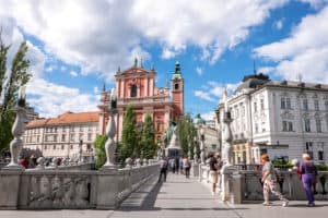 The Triple Bridge is one of the things to see in Ljubljana. connecting parts of the pink and pastel old town.