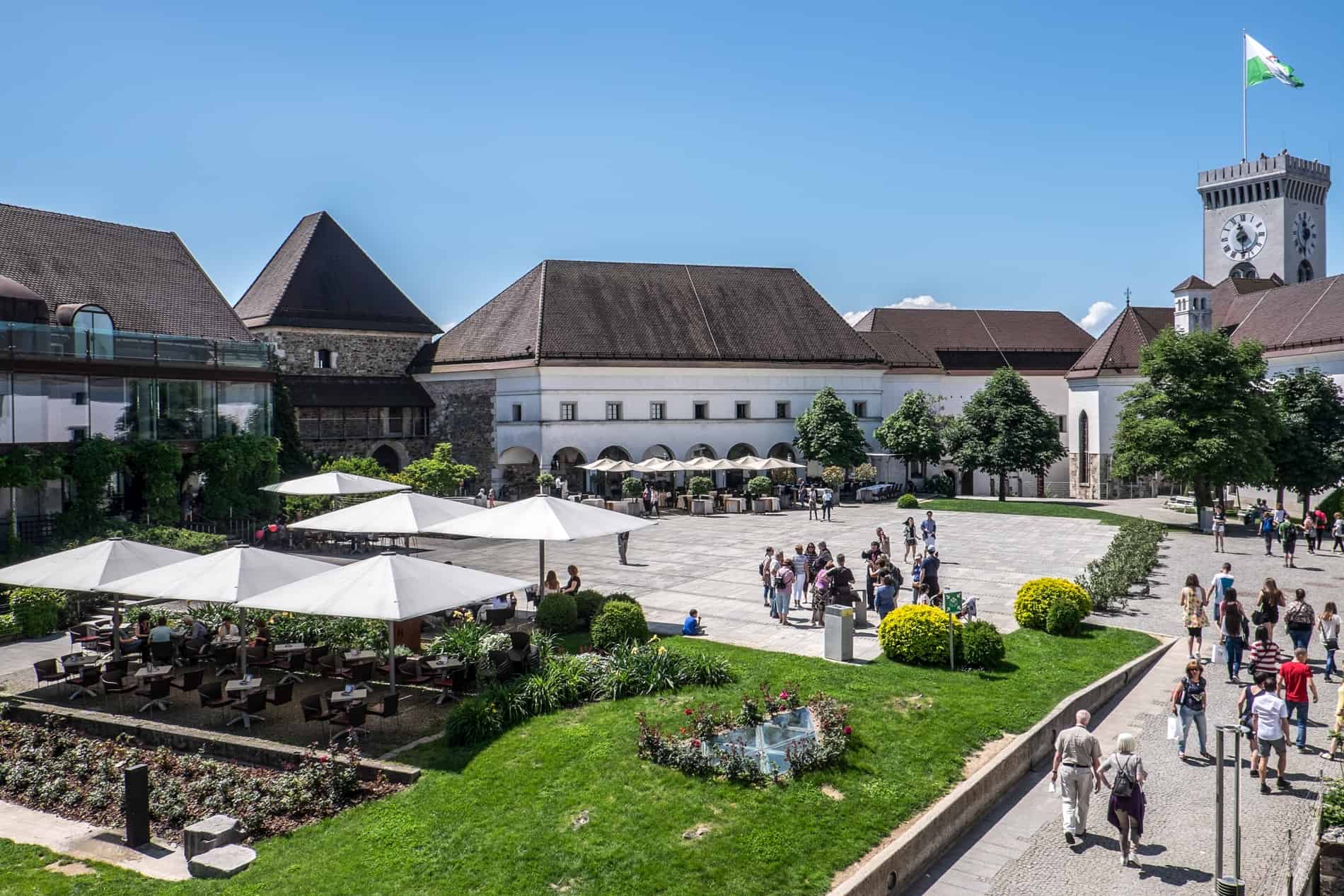 Visitors inside the fortress grounds of Ljubljana Castle, high up on a hill. 