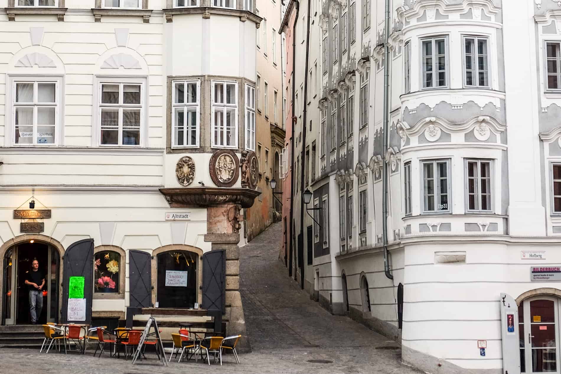 Gold emblems and carved window details on buildings in Linz Old Town, Austria. 