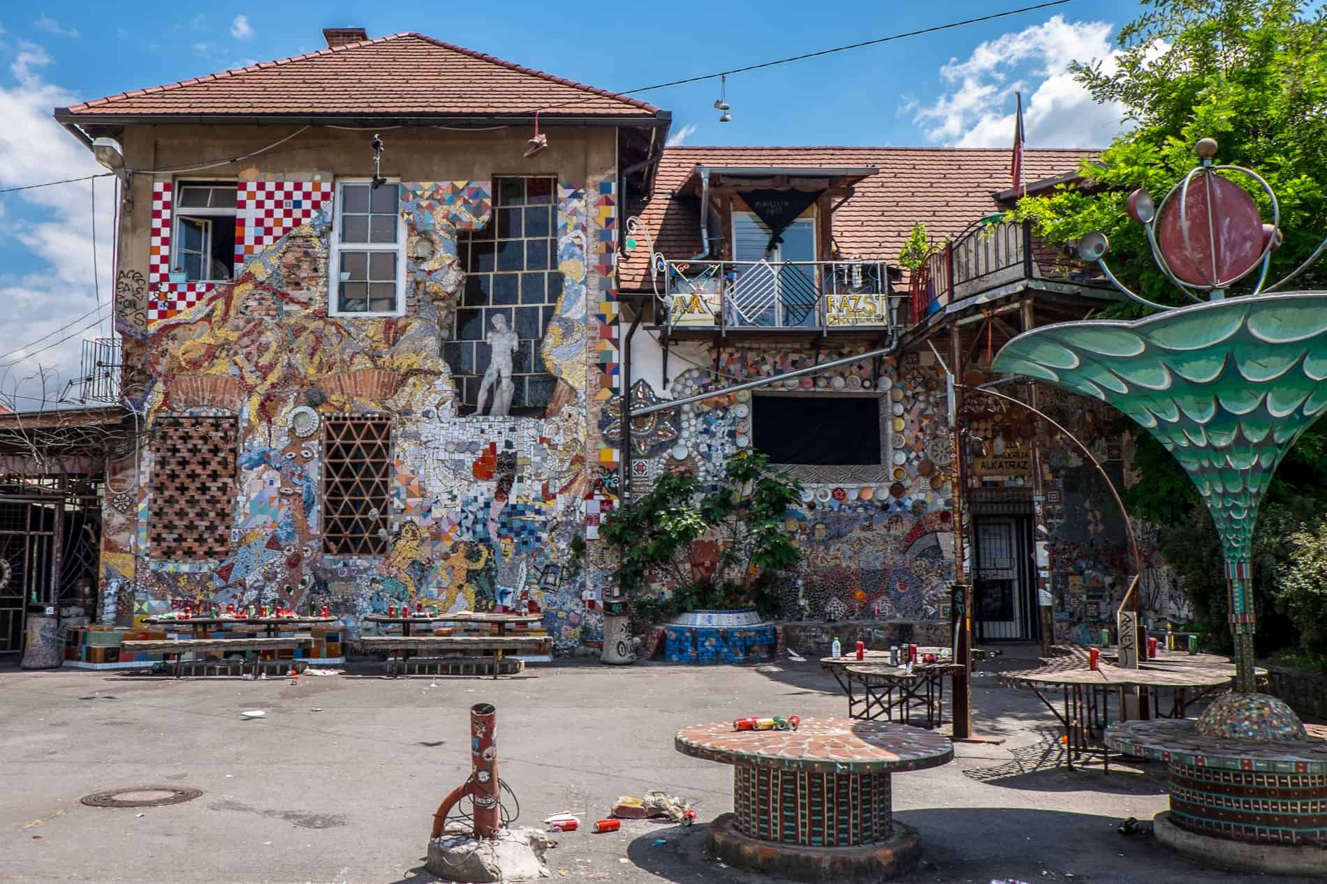 A mosaic covered bar and venue space in the Metelkova art space in Ljubljana. 