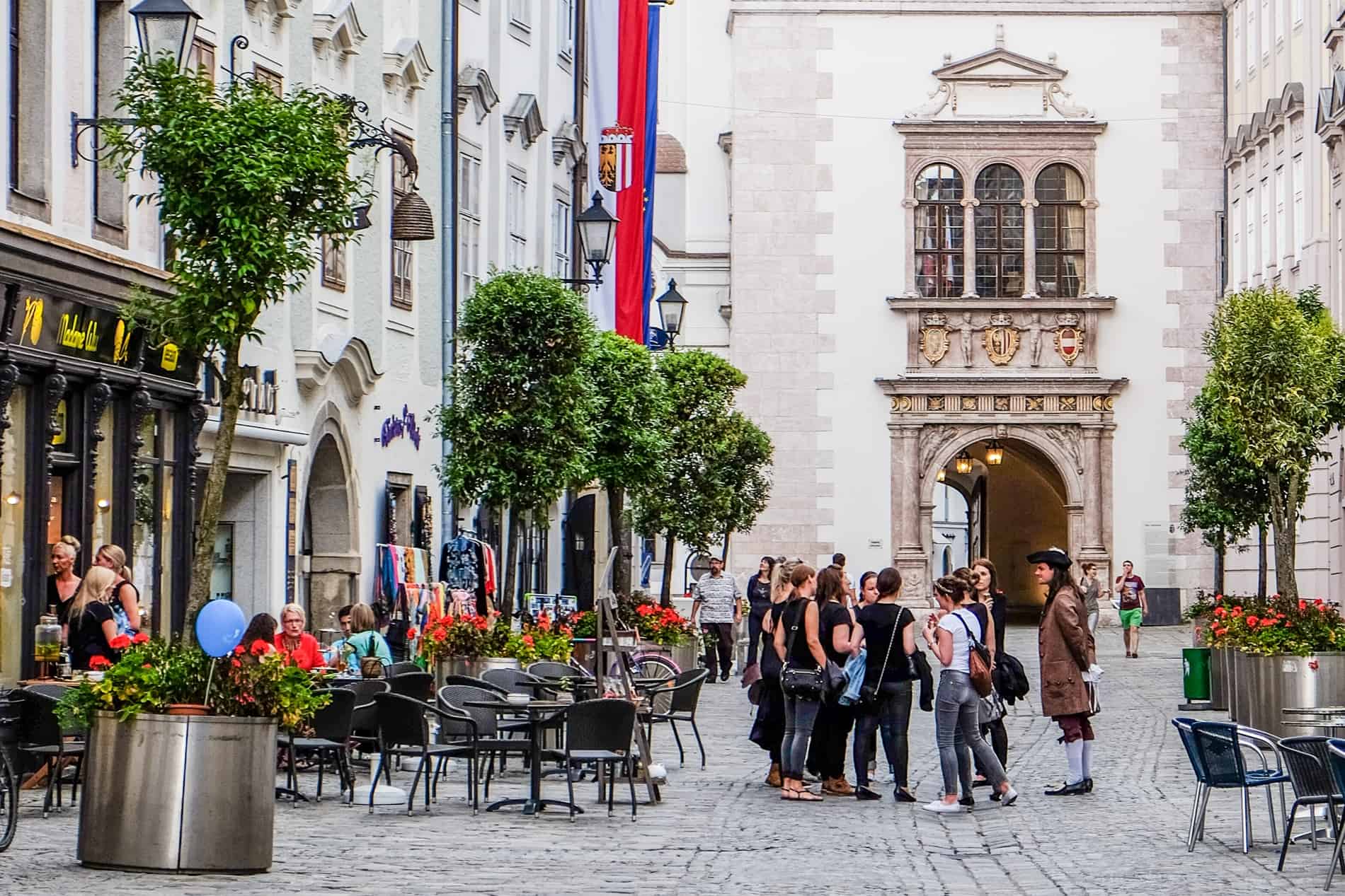 A man in centuries-old costume leads a Theatre Costume Guided Tour in Linz, Austria. 