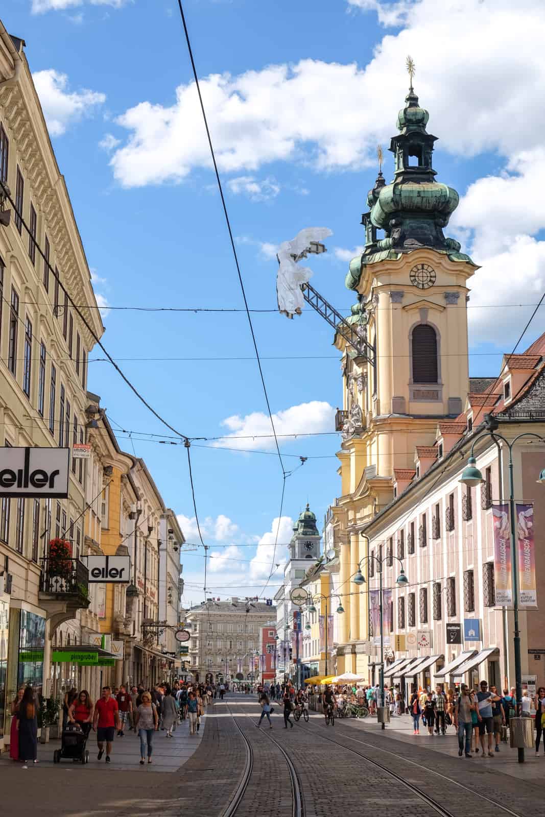 A protruding angel artwork on the Ursulinen Church in Linz, Austria. 