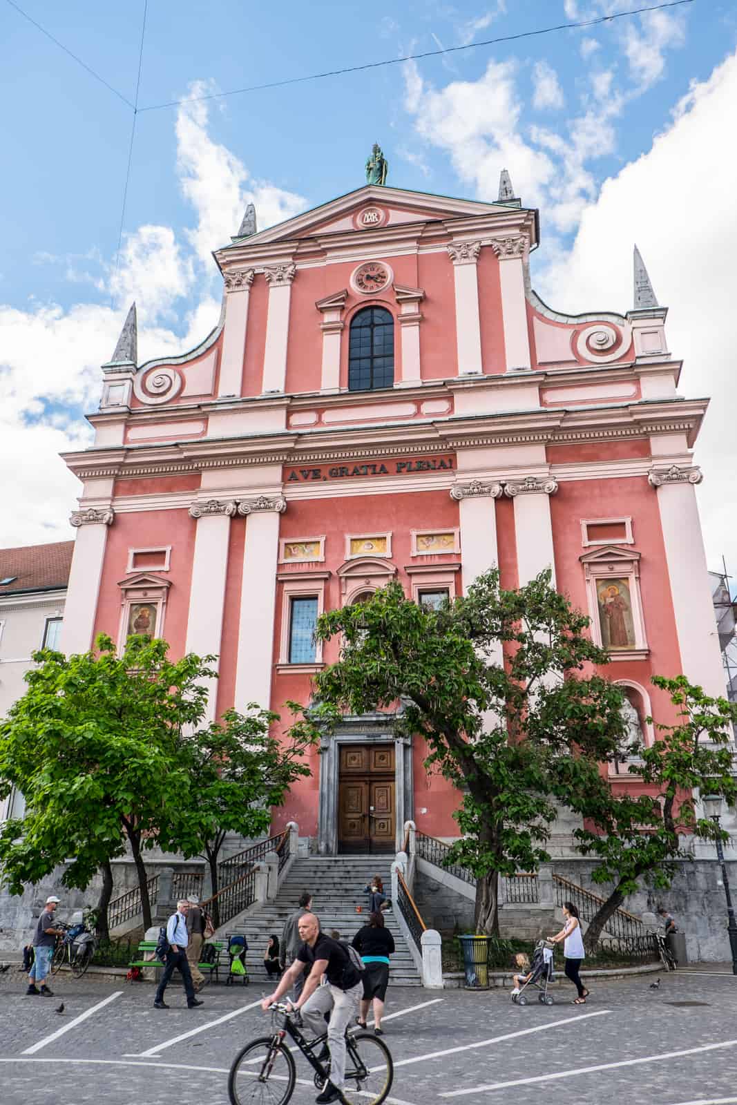 The pink, classical style Franciscan Church of the Annunciation on Prešeren Square in Ljubljana. 