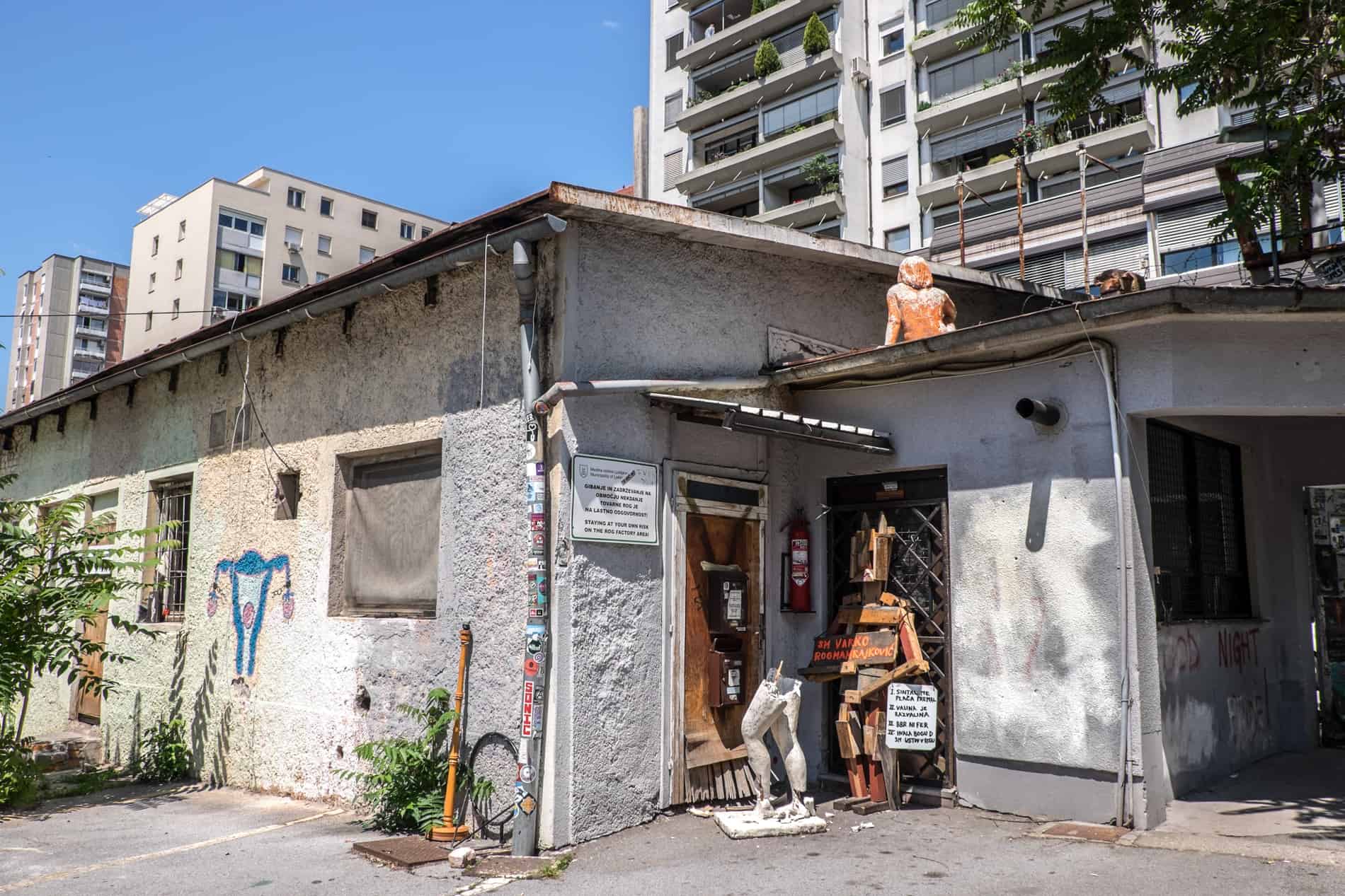 Sculptures at the entrance building to an abandoned factory in Ljubljana. 