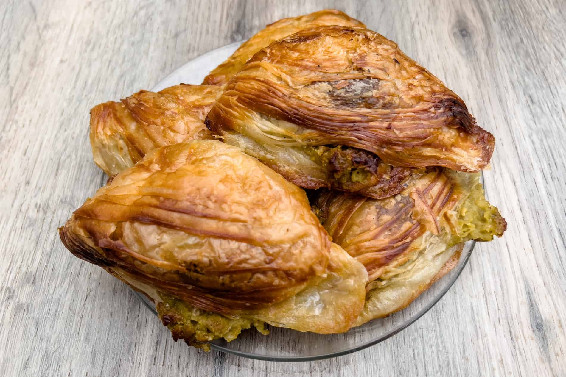 A plate of Malteste Pastizzi - flaky cheese and pea-filled pastries. 