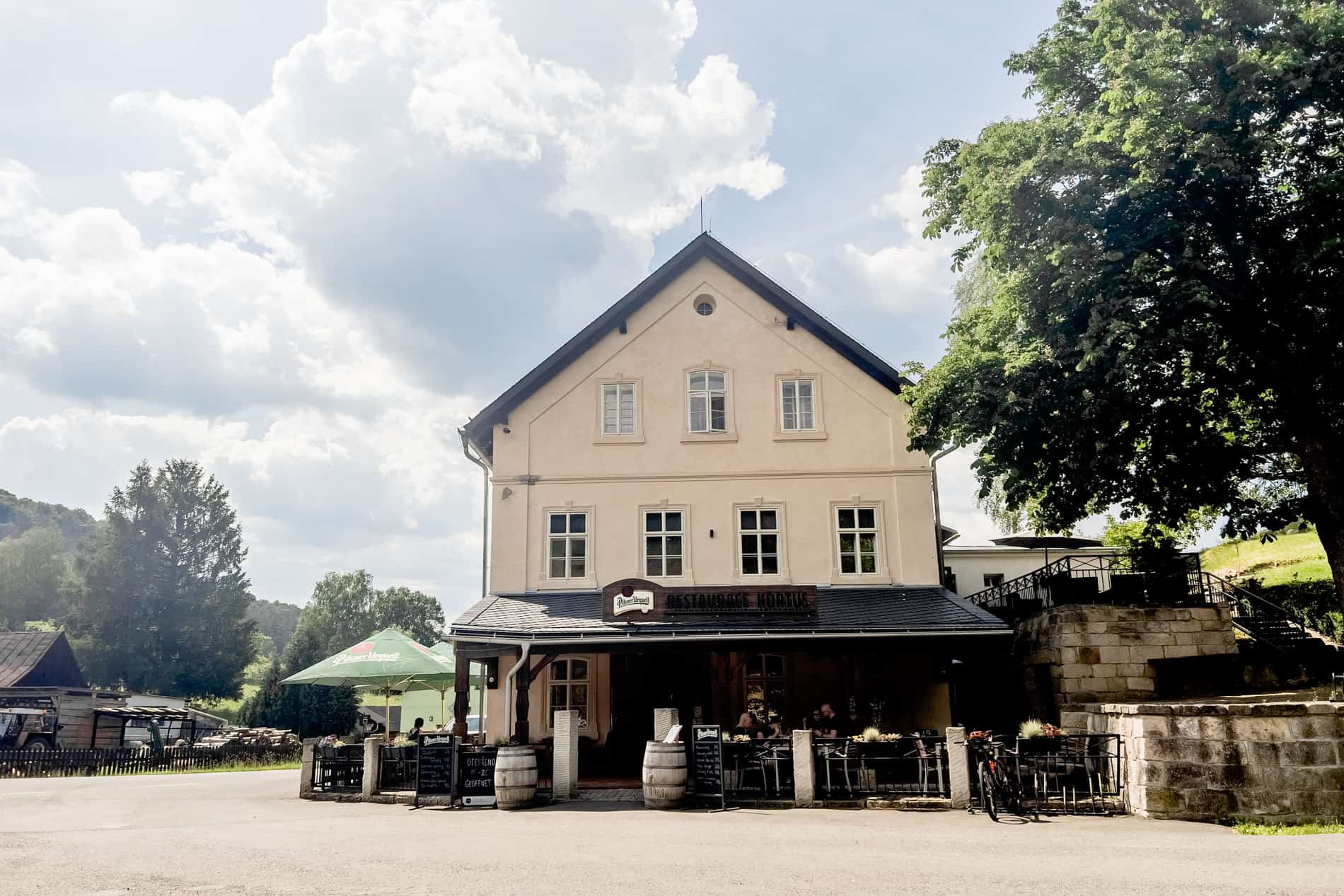 A beige classic taverna and historic Hotel Kortus in Vysoká Lípa village, Czech Republic. 