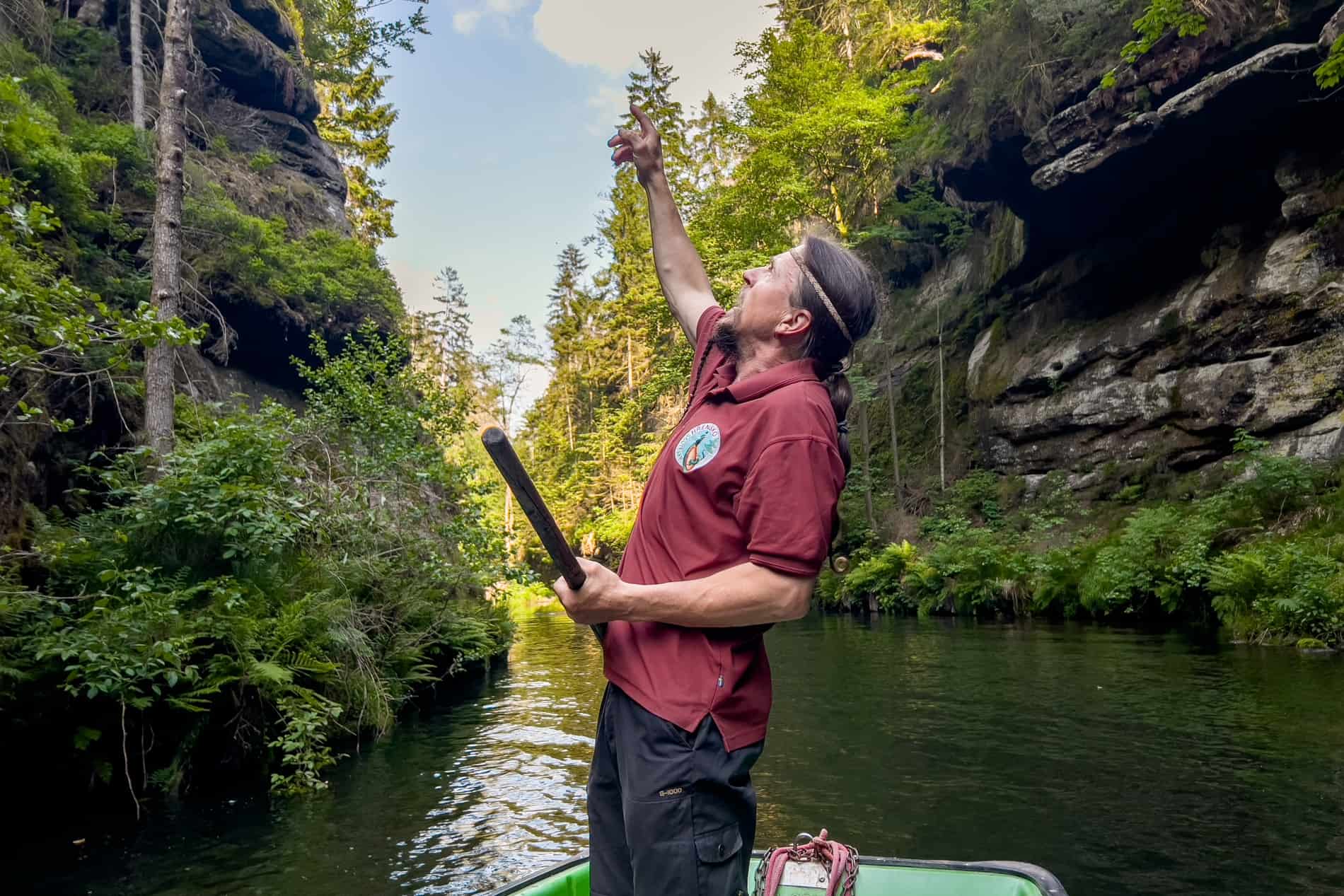 A river boat guide points out the natural highlights of the Wild Gorge in Bohemian Switzerland. 