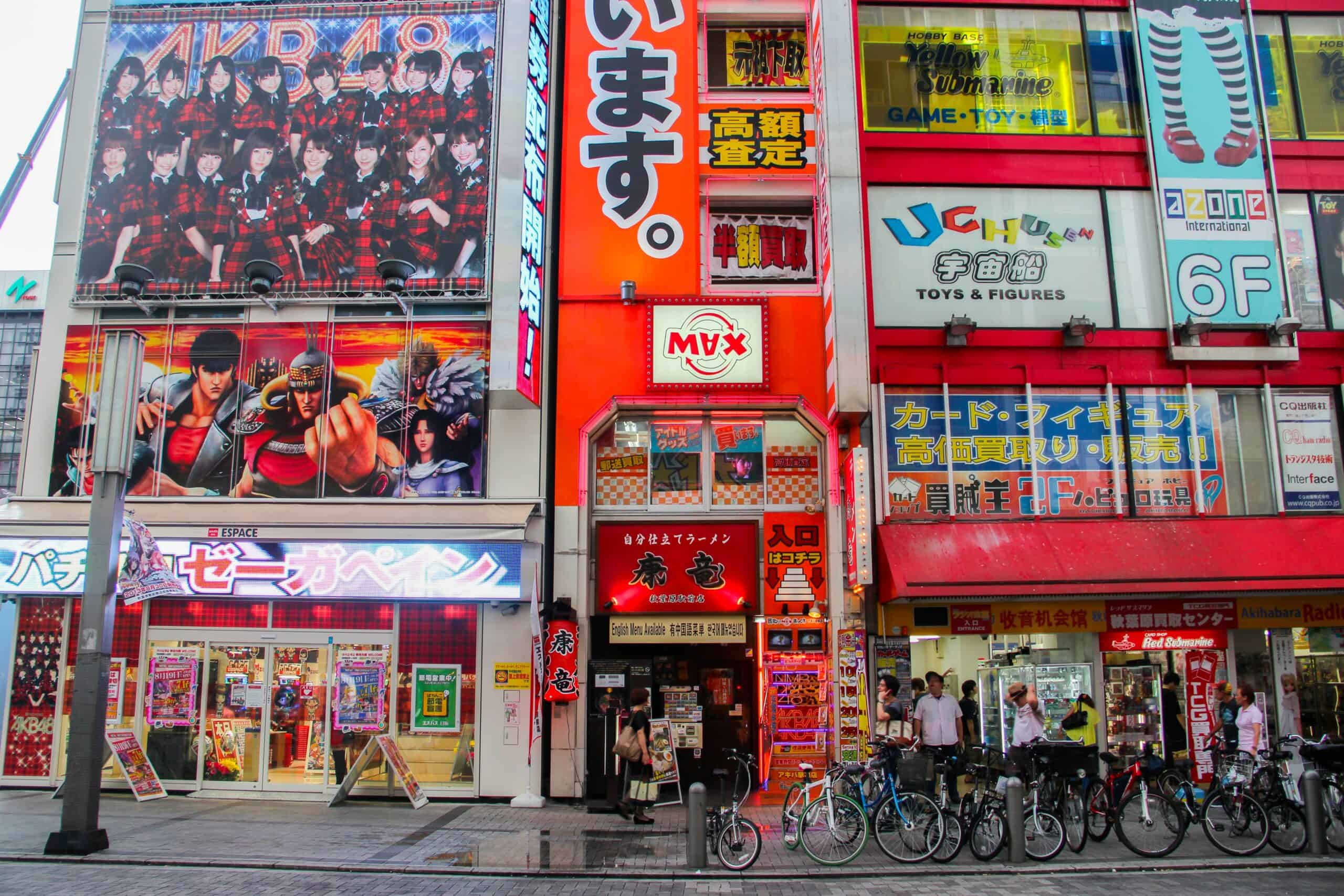 Large, bold advertising on a red building in Tokyo's Akihabara entertainment district. 