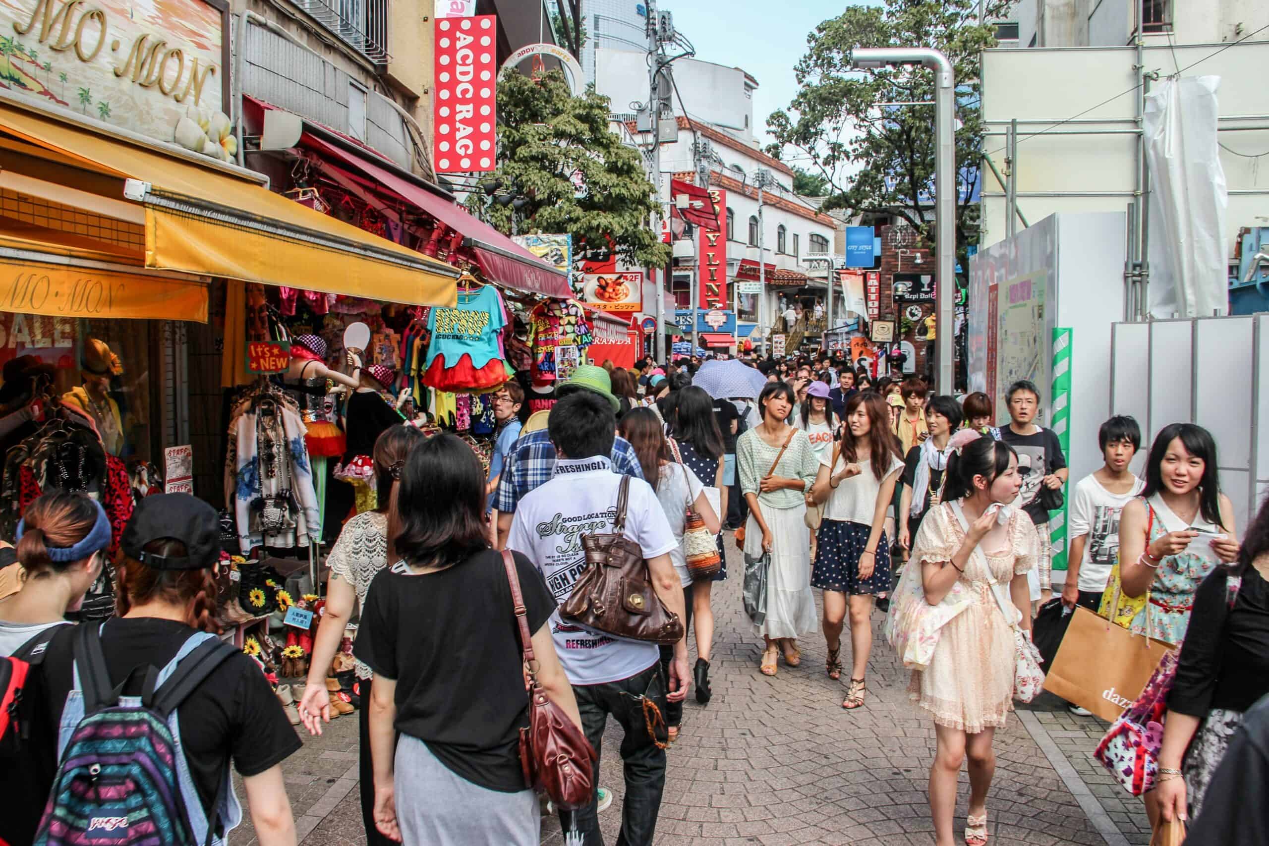 A crowd of people on the popular shopping street of Takeshita in Harajuku Tokyo.