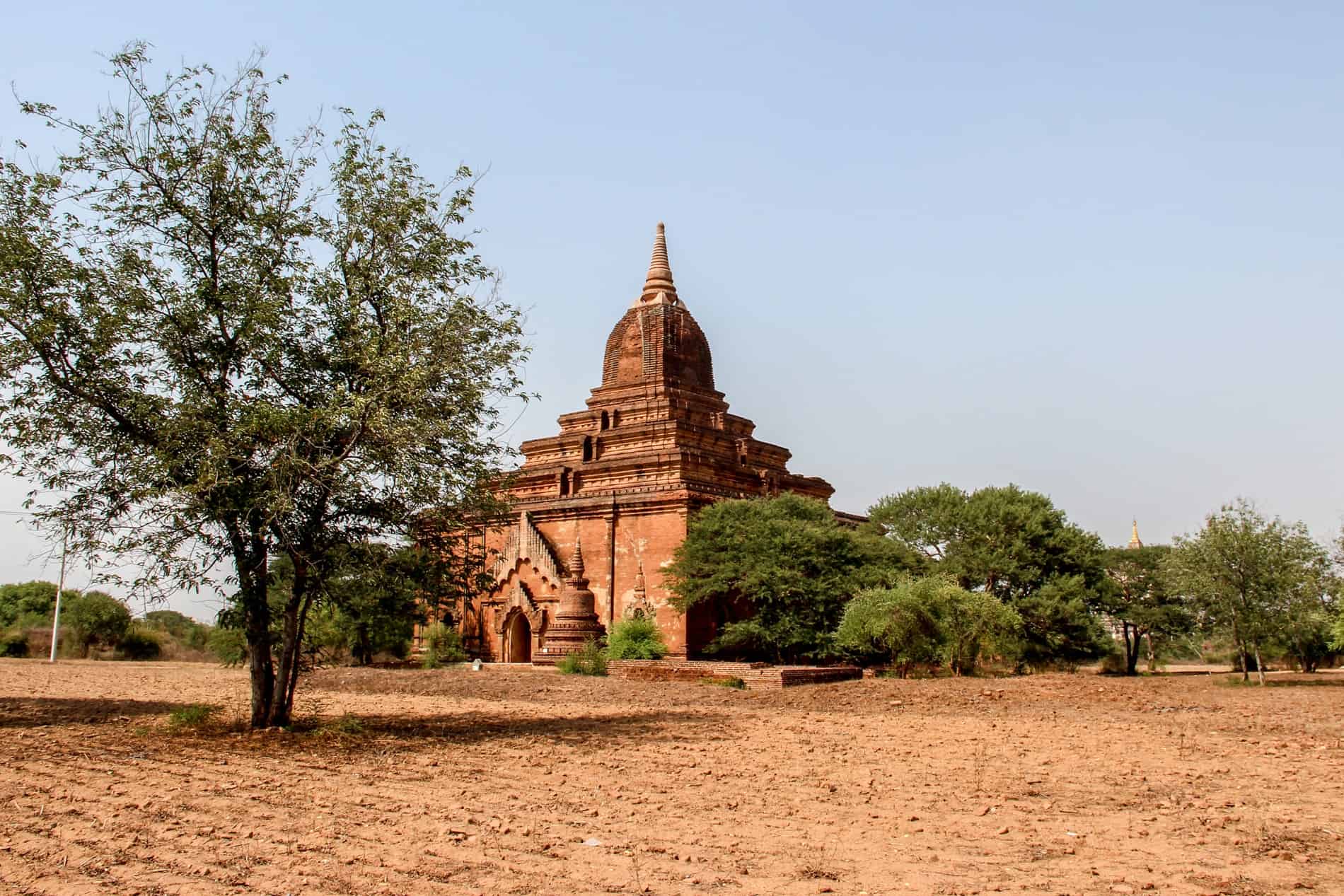 The four-tiered and spired orange brick Mee Nyein Gone Temple in Old Bagan, Myanmar. 