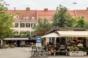 Bikes, flowerrs stalls and a small bar at Graz's biggest farmers market on Kaiser-Josef-Platz.