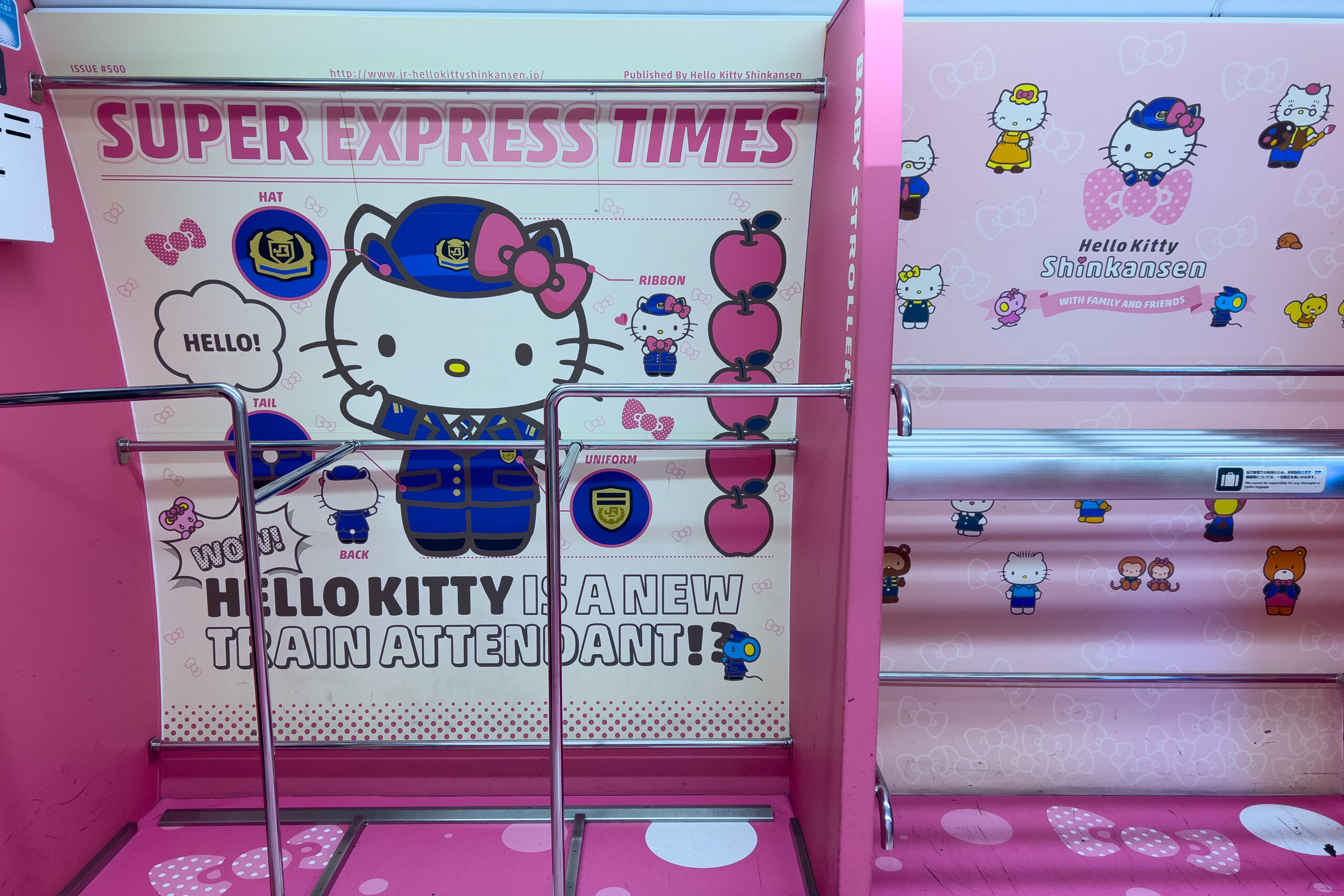 The bright pink luggage rack of the Hello Kitty Shinkansen train featuring playful graphics of Hello Kitty as a train attendant.
