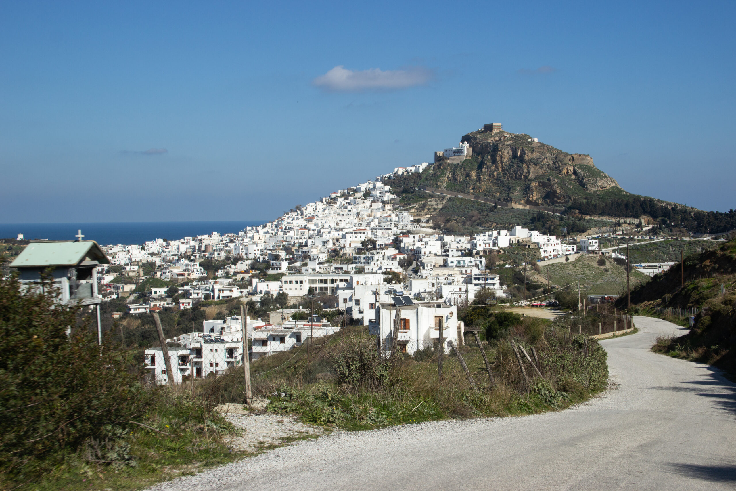 Panoramic viewpoint of Skyros (Chora) town hillside scattered with bright white buildings.